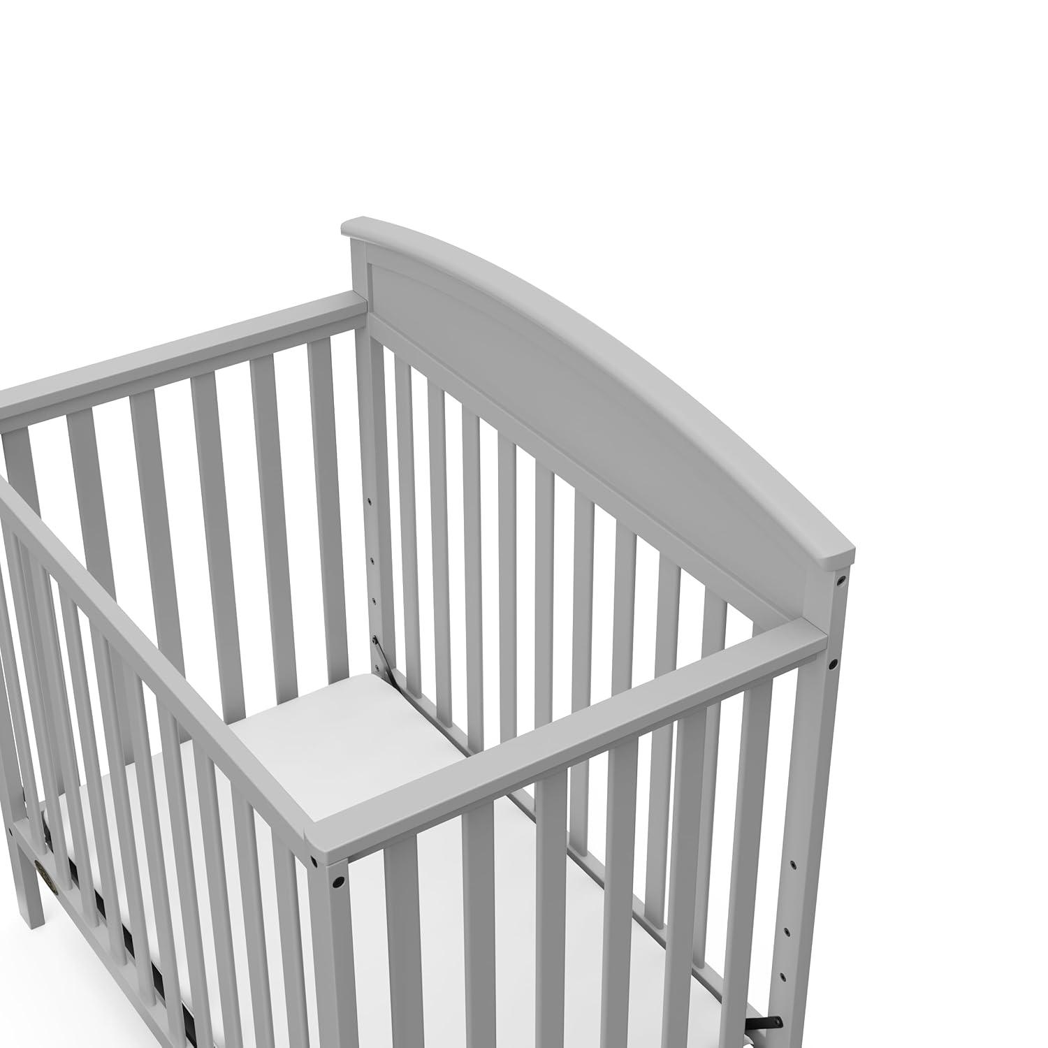 imageGraco Benton 4in1 Convertible Mini Crib with Bonus Crib Mattress White GREENGUARD Gold Certified 275Inch Mattress Included Baby Crib Converts to Twin Bed Ideal for Small SpacesPebble Gray