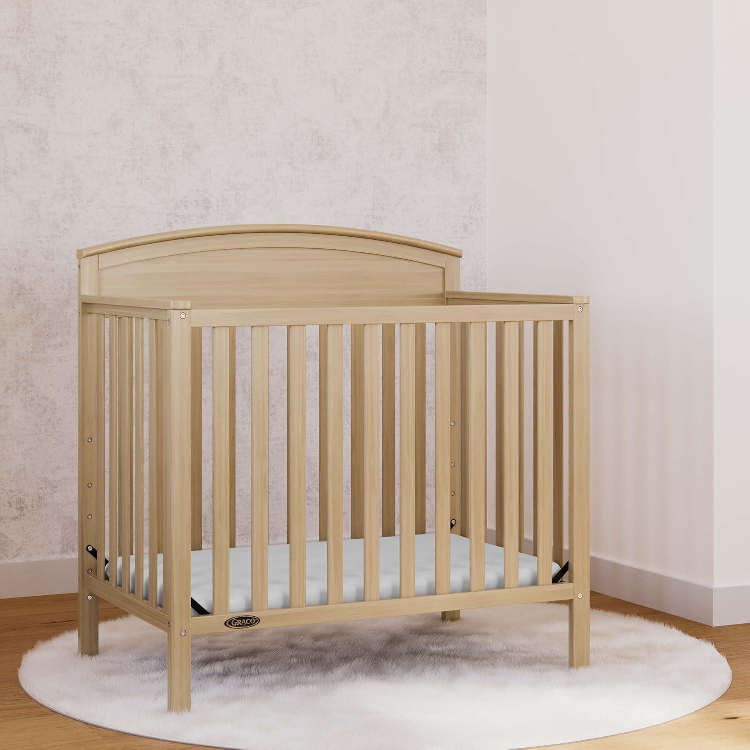 imageGraco Benton 4in1 Convertible Mini Crib with Bonus Crib Mattress White GREENGUARD Gold Certified 275Inch Mattress Included Baby Crib Converts to Twin Bed Ideal for Small SpacesDriftwood
