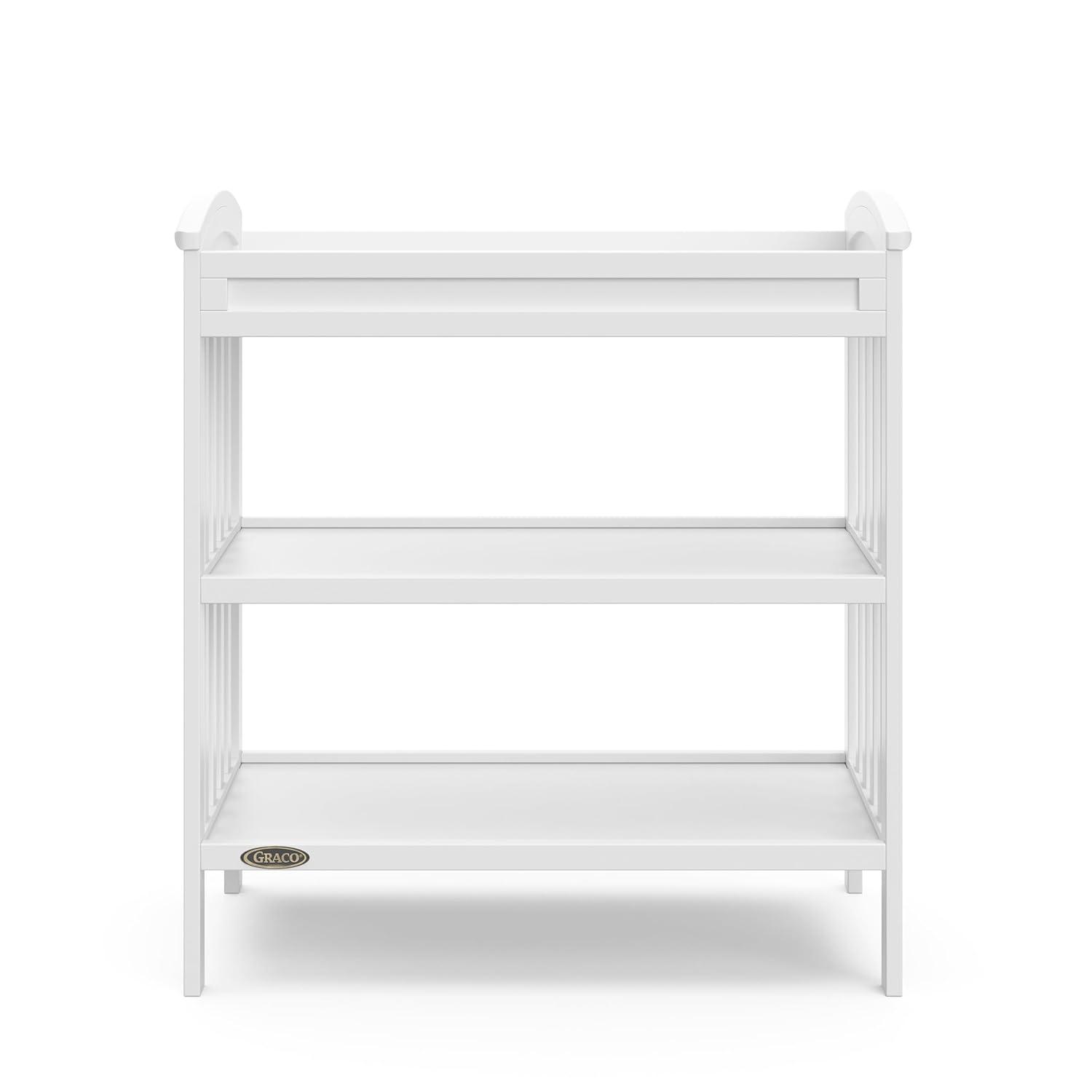 imageGraco Benton Changing Table with Bonus WaterResistant Changing Pad White GREENGUARD Gold Certified Includes Diaper Change Pad with Safety Strap 2 Open Storage Shelves for OrganizingWhite