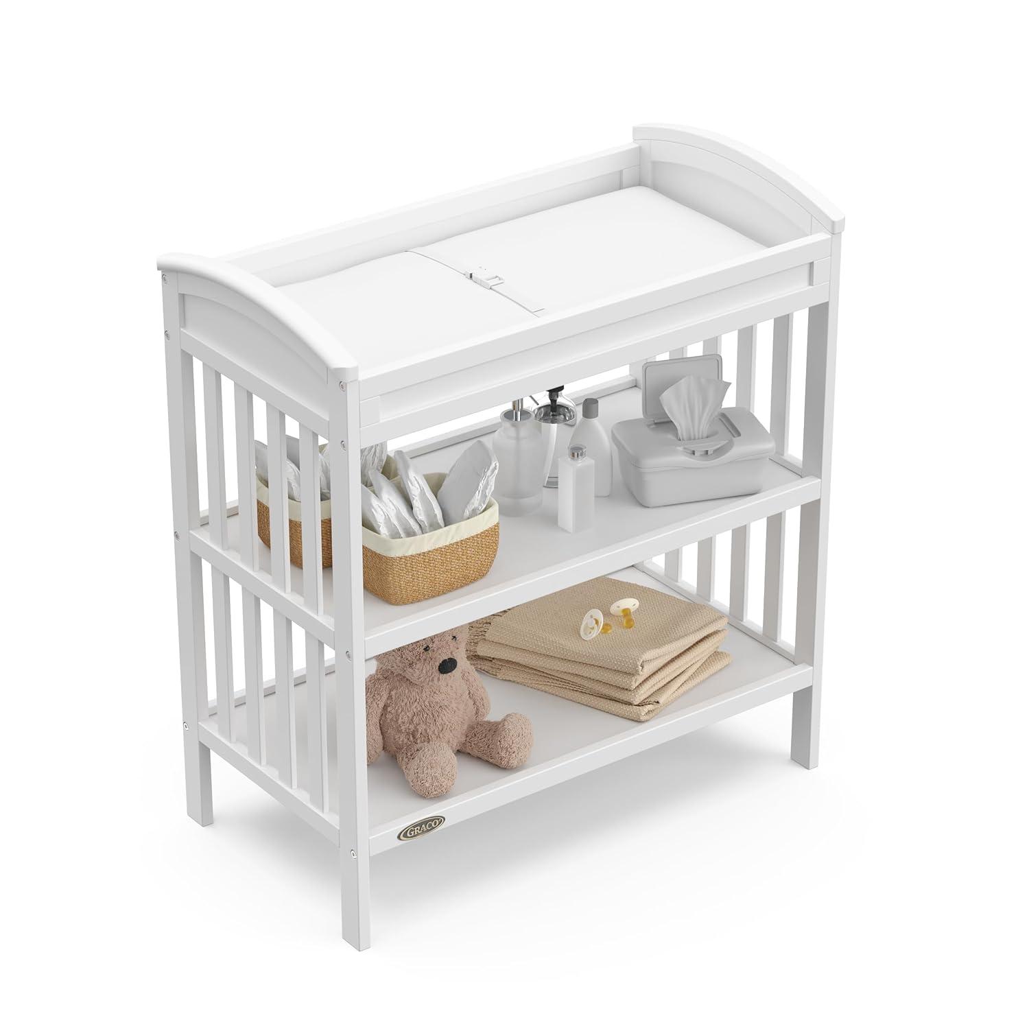 imageGraco Benton Changing Table with Bonus WaterResistant Changing Pad White GREENGUARD Gold Certified Includes Diaper Change Pad with Safety Strap 2 Open Storage Shelves for OrganizingWhite