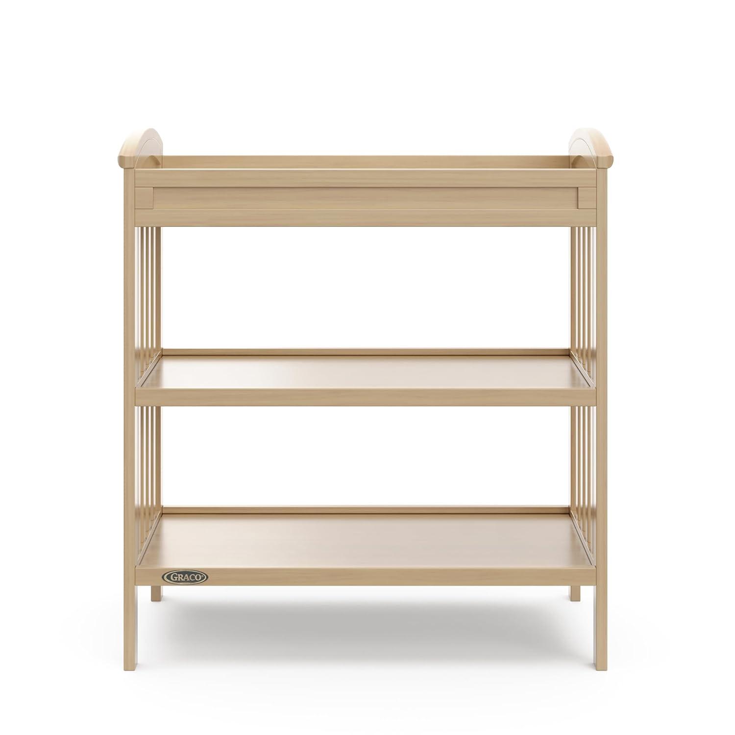 imageGraco Benton Changing Table with Bonus WaterResistant Changing Pad White GREENGUARD Gold Certified Includes Diaper Change Pad with Safety Strap 2 Open Storage Shelves for OrganizingDriftwood