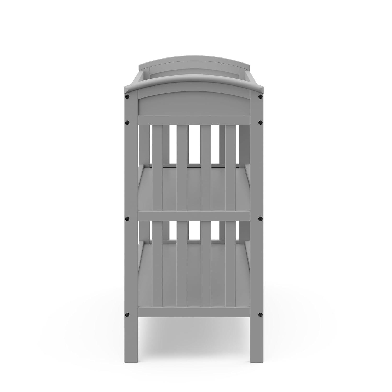 imageGraco Benton Changing Table with Bonus WaterResistant Changing Pad White GREENGUARD Gold Certified Includes Diaper Change Pad with Safety Strap 2 Open Storage Shelves for OrganizingPebble Gray