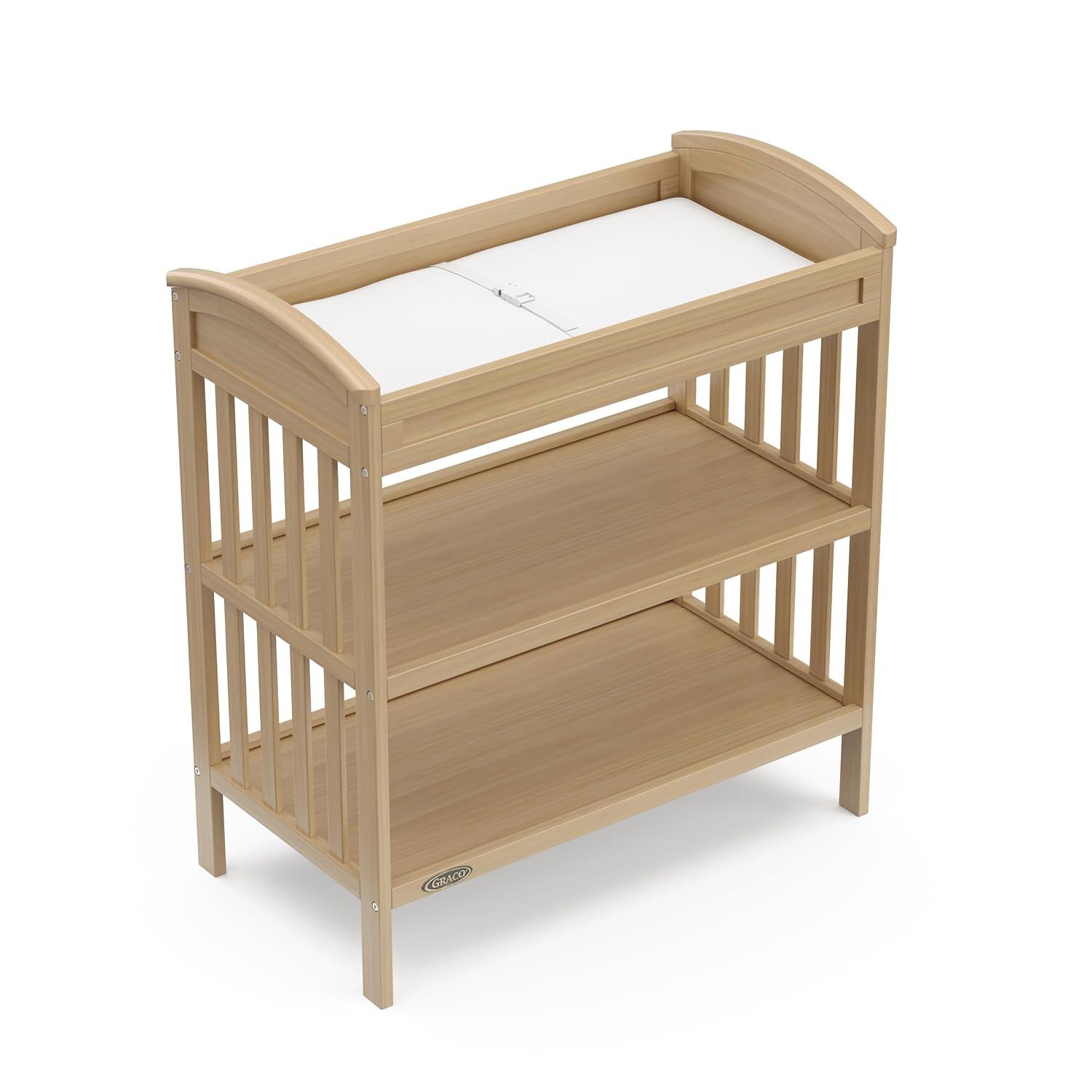 imageGraco Benton Changing Table with Bonus WaterResistant Changing Pad White GREENGUARD Gold Certified Includes Diaper Change Pad with Safety Strap 2 Open Storage Shelves for OrganizingDriftwood