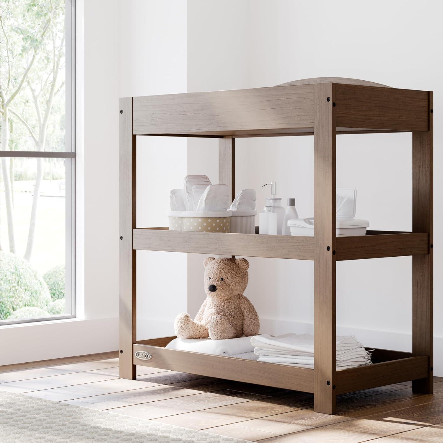 imageGraco Customizable Changing Table with WaterResistant Changing Pad White Customizable Modern Flat or Classic Arched Headboard Baby Diaper Changing Pad IncludedHazelnut