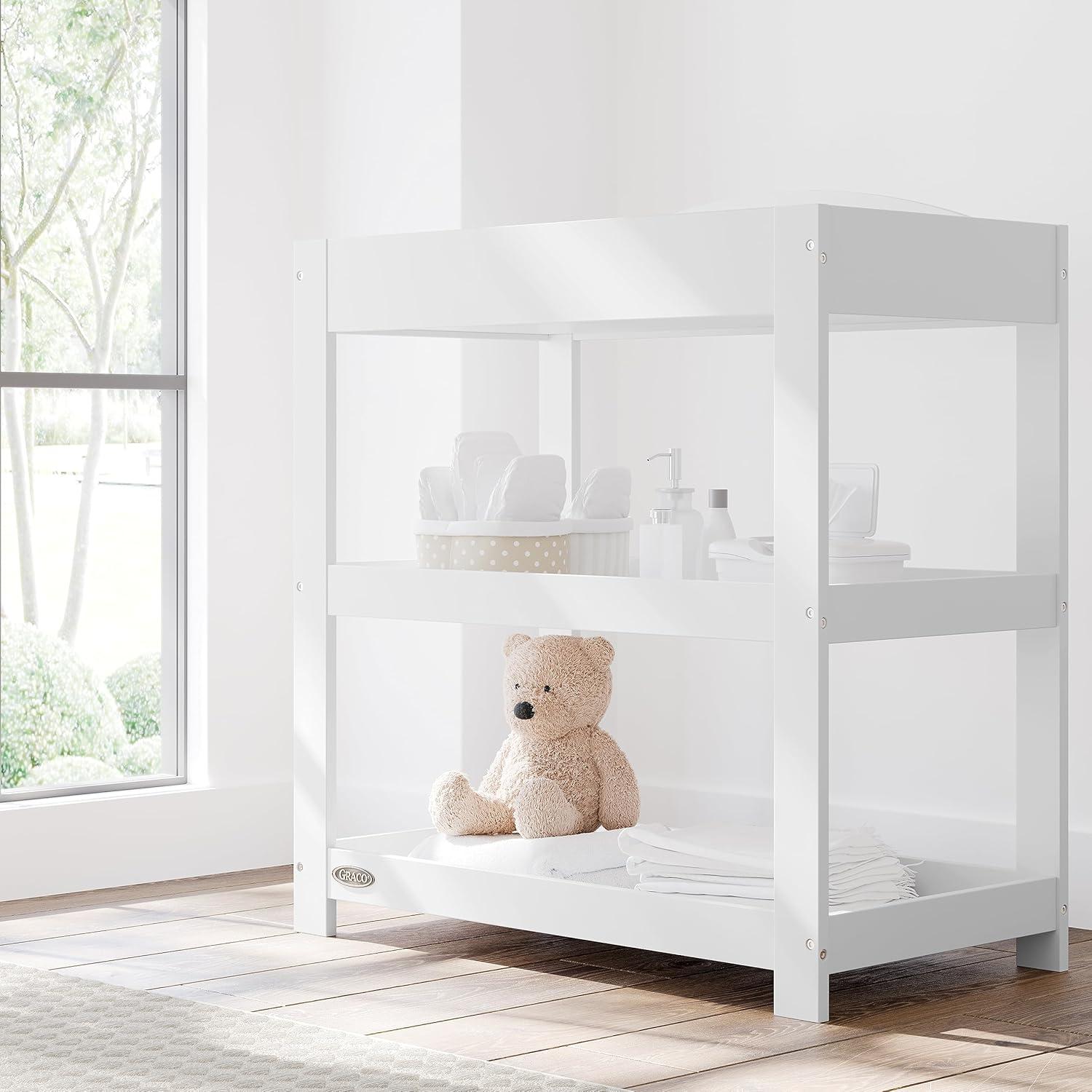 imageGraco Customizable Changing Table with WaterResistant Changing Pad White Customizable Modern Flat or Classic Arched Headboard Baby Diaper Changing Pad IncludedWhite