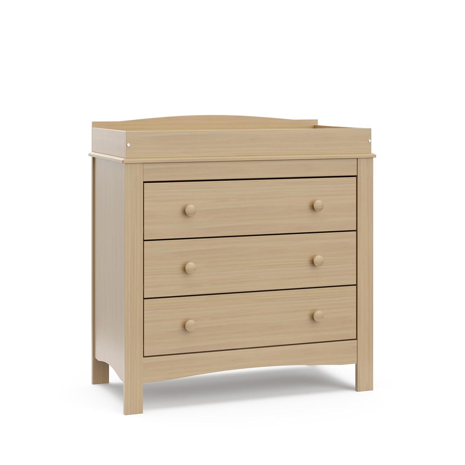 imageGraco Noah 3 Drawer Changing Table Dresser White GREENGUARD Gold Certified Baby Dresser with Changing Table Top Includes Interlocking Drawer SystemDriftwood