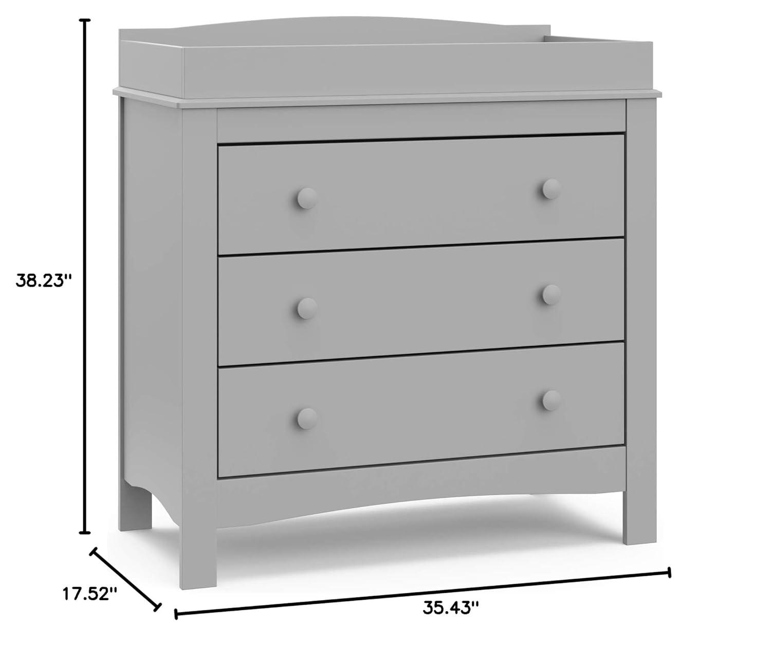 imageGraco Noah 3 Drawer Changing Table Dresser White GREENGUARD Gold Certified Baby Dresser with Changing Table Top Includes Interlocking Drawer SystemPebble Gray