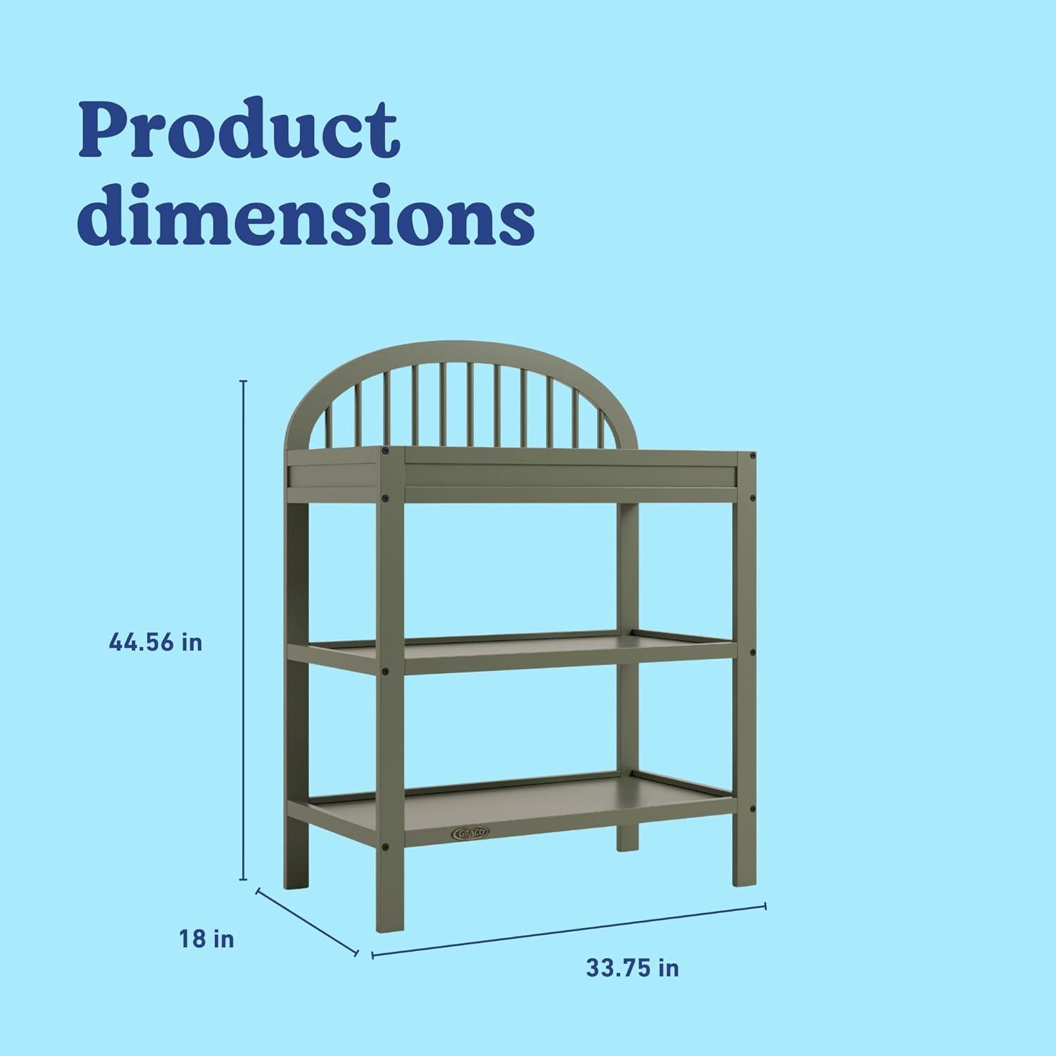 imageGraco Olivia Changing Table with WaterResistant Changing Pad Driftwood GREENGUARD Gold Certified Includes Bonus WaterResistant Changing Pad with Safety Strap 2 Open Shelves Stylish DesignOlive