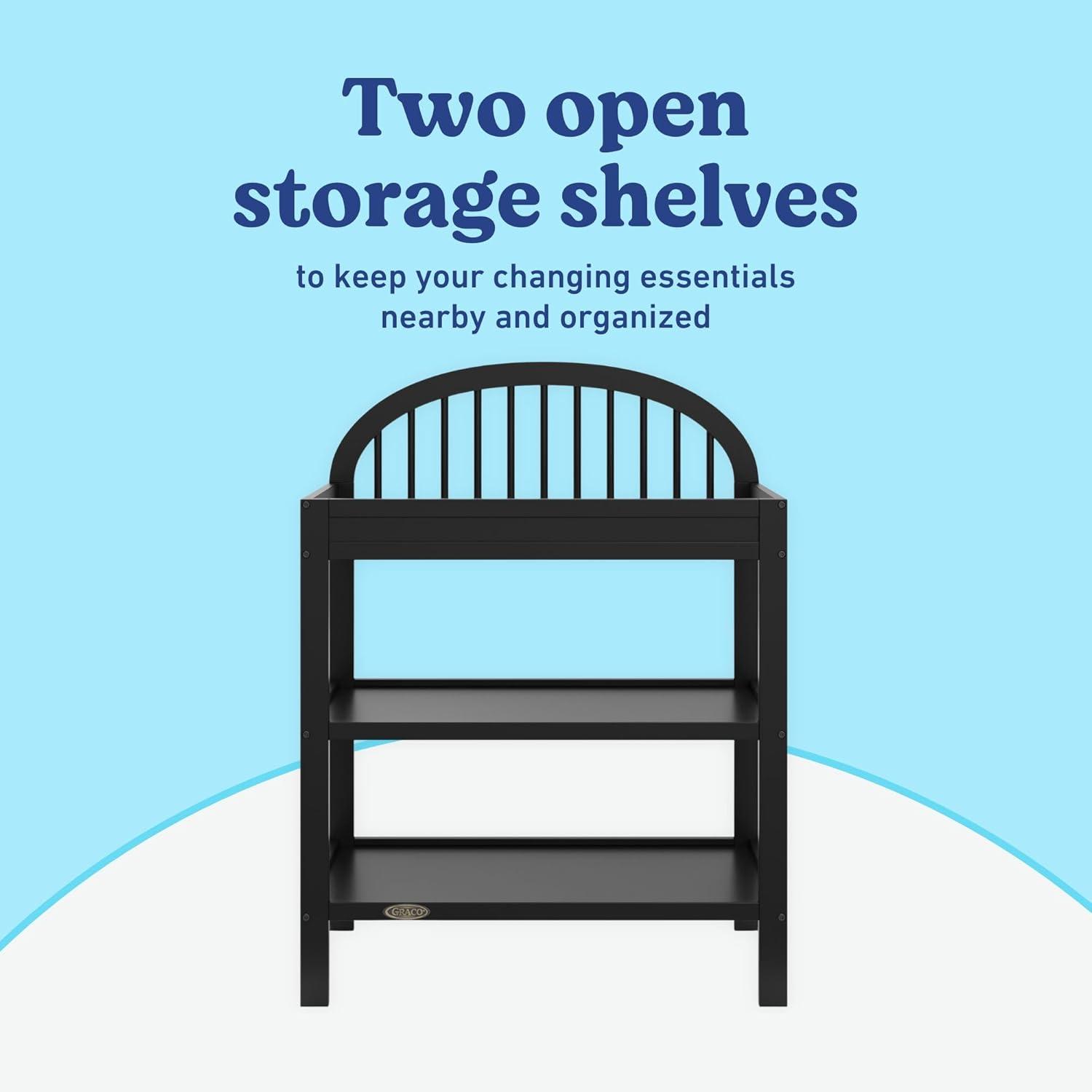 imageGraco Olivia Changing Table with WaterResistant Changing Pad Driftwood GREENGUARD Gold Certified Includes Bonus WaterResistant Changing Pad with Safety Strap 2 Open Shelves Stylish DesignBlack