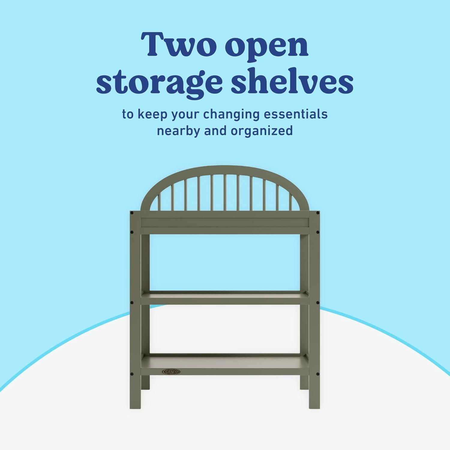 imageGraco Olivia Changing Table with WaterResistant Changing Pad Driftwood GREENGUARD Gold Certified Includes Bonus WaterResistant Changing Pad with Safety Strap 2 Open Shelves Stylish DesignOlive