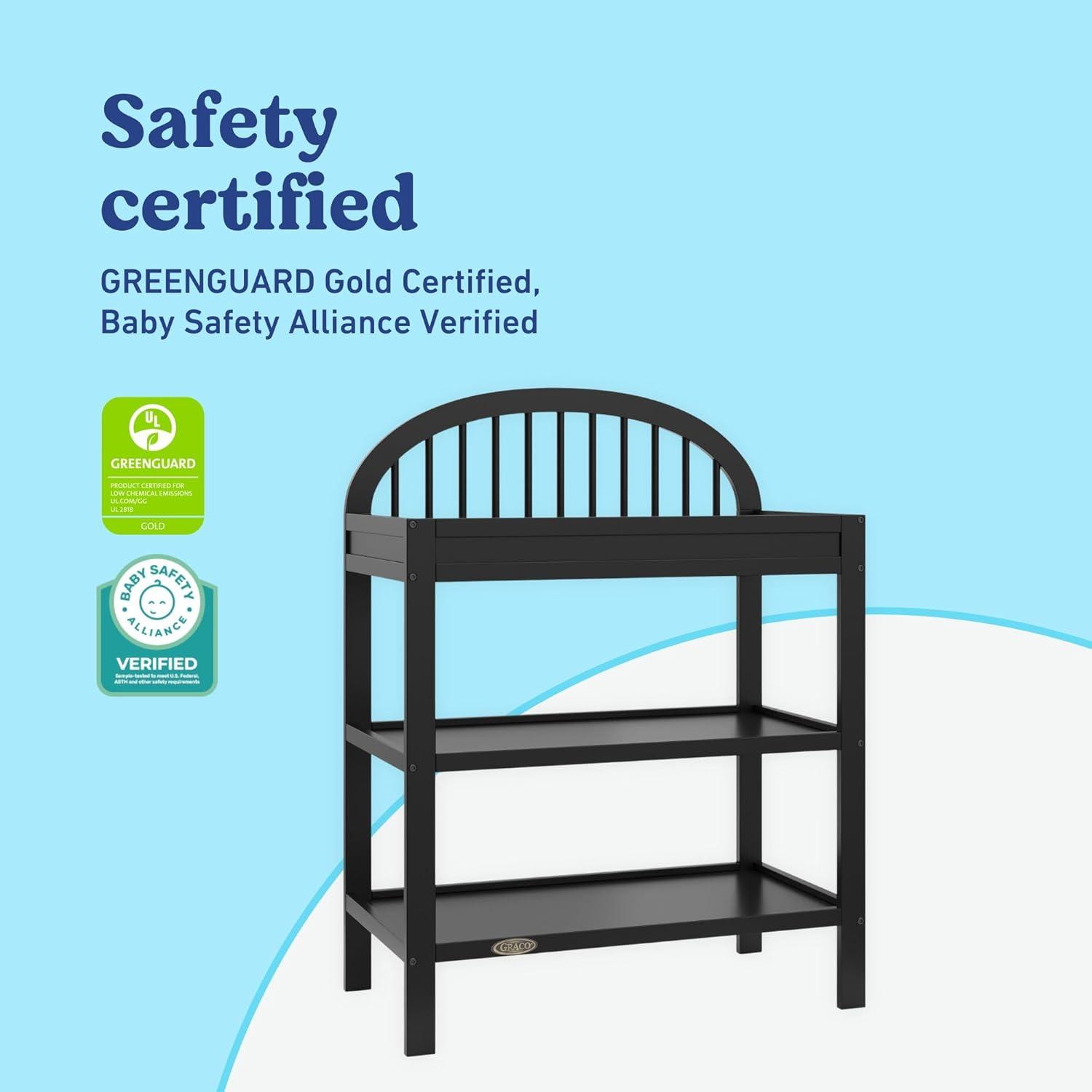 imageGraco Olivia Changing Table with WaterResistant Changing Pad Driftwood GREENGUARD Gold Certified Includes Bonus WaterResistant Changing Pad with Safety Strap 2 Open Shelves Stylish DesignBlack