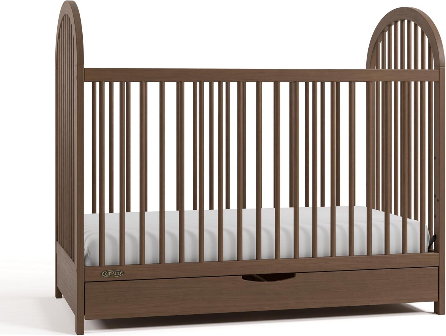 imageGraco Olivia Convertible Crib White GREENGUARD Gold Certified 100 Solid Wood Fits Standard Crib Mattress Converts to Toddler Bed and Daybed 4 Adjustable Mattress HeightsHazelnut