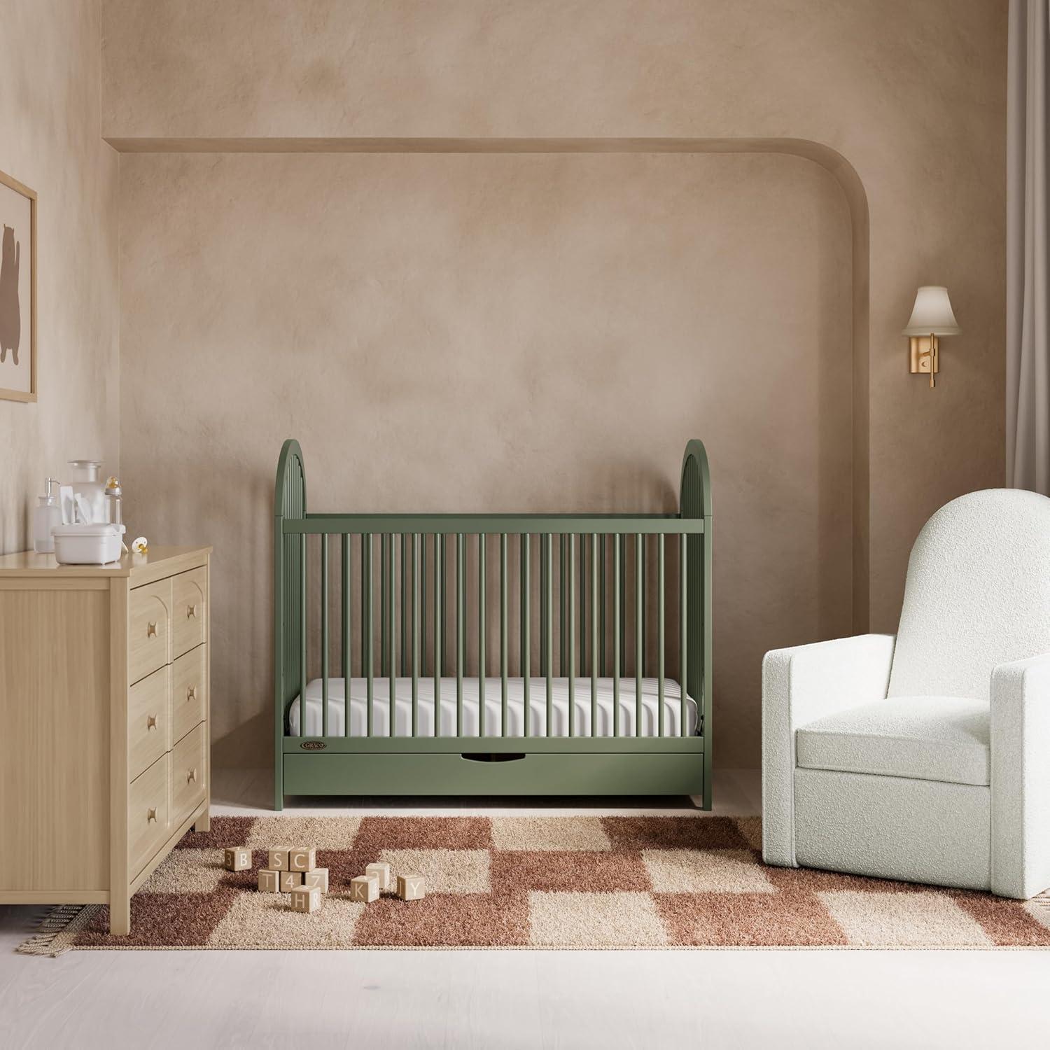 imageGraco Olivia Convertible Crib White GREENGUARD Gold Certified 100 Solid Wood Fits Standard Crib Mattress Converts to Toddler Bed and Daybed 4 Adjustable Mattress HeightsOlive