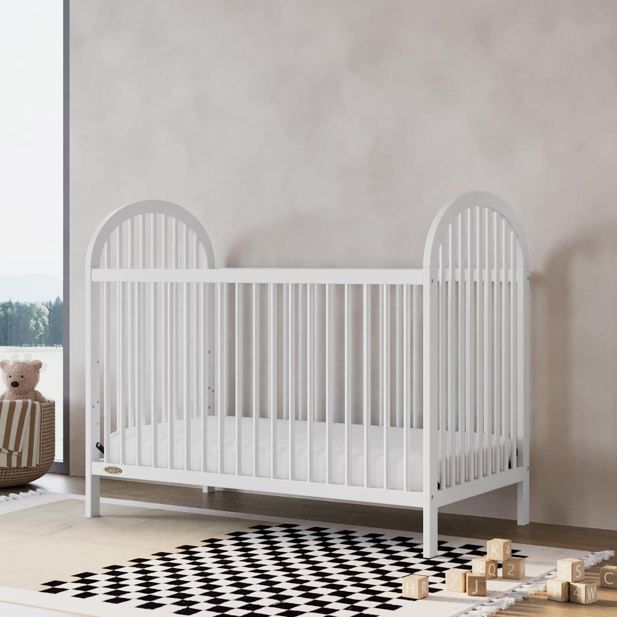 imageGraco Olivia Convertible Crib White GREENGUARD Gold Certified 100 Solid Wood Fits Standard Crib Mattress Converts to Toddler Bed and Daybed 4 Adjustable Mattress HeightsWhite