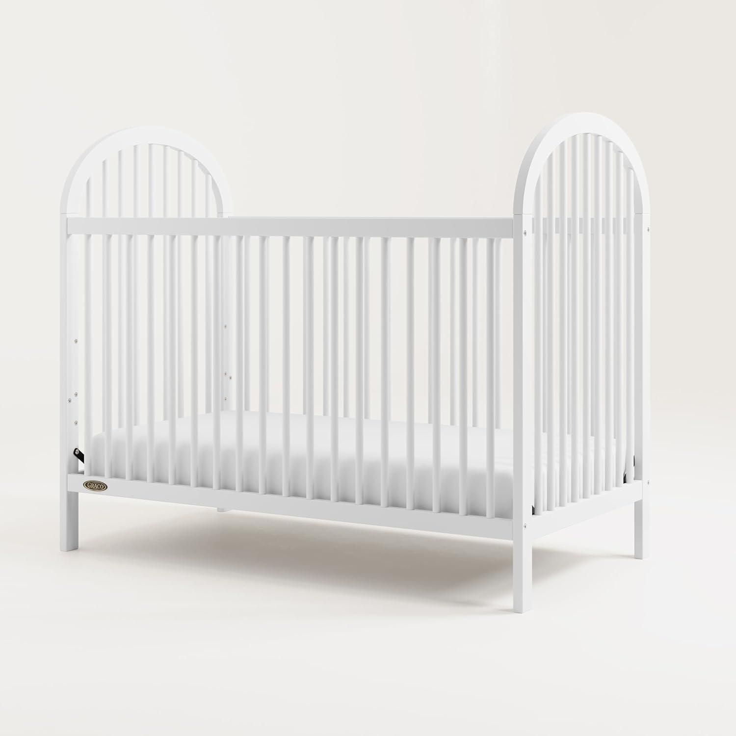 imageGraco Olivia Convertible Crib White GREENGUARD Gold Certified 100 Solid Wood Fits Standard Crib Mattress Converts to Toddler Bed and Daybed 4 Adjustable Mattress HeightsWhite