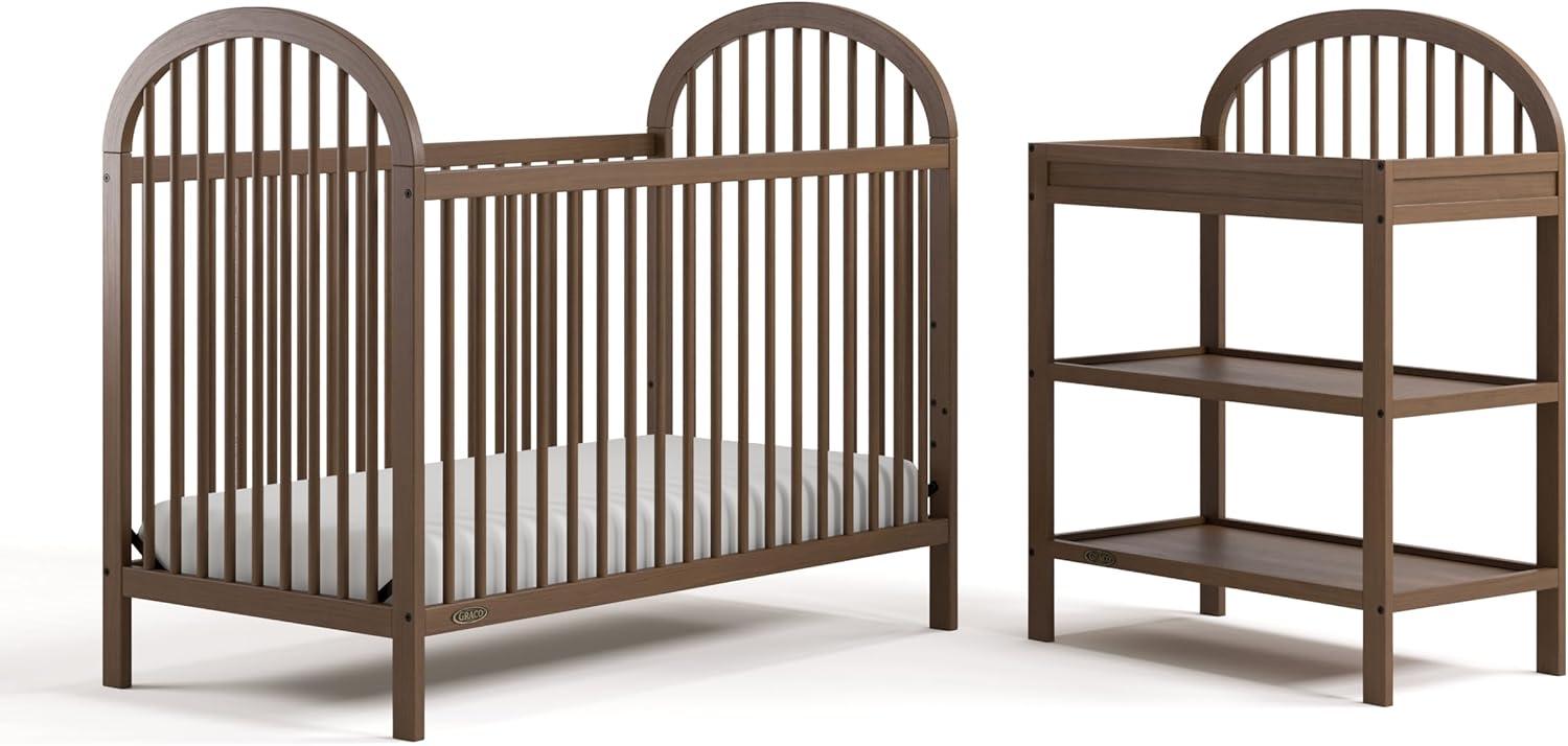 imageGraco Olivia Convertible Crib White GREENGUARD Gold Certified 100 Solid Wood Fits Standard Crib Mattress Converts to Toddler Bed and Daybed 4 Adjustable Mattress HeightsHazelnut