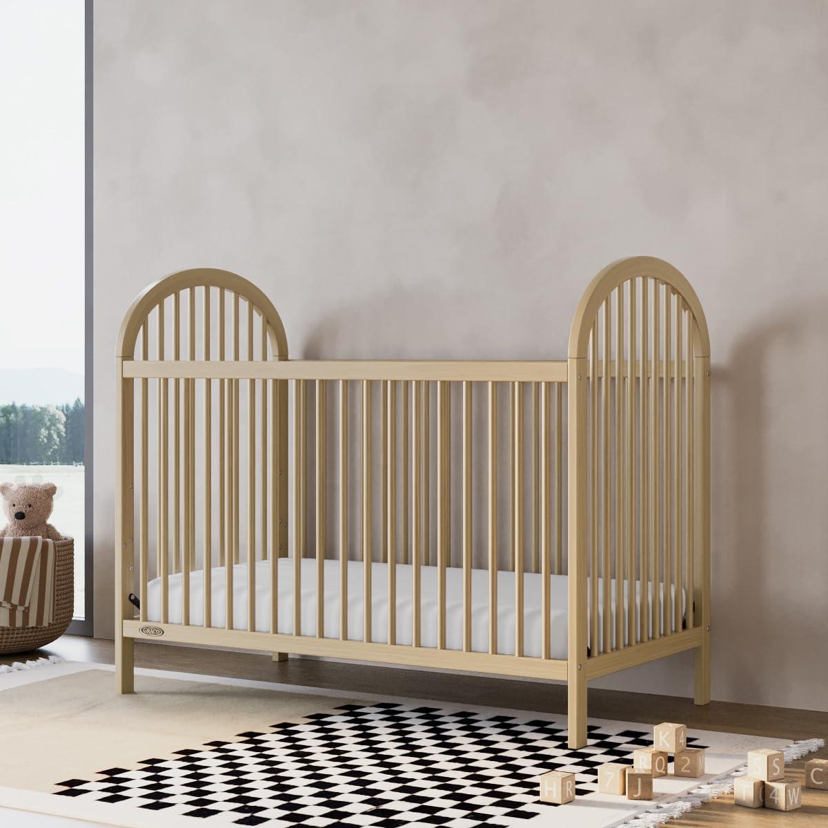 imageGraco Olivia Convertible Crib White GREENGUARD Gold Certified 100 Solid Wood Fits Standard Crib Mattress Converts to Toddler Bed and Daybed 4 Adjustable Mattress HeightsDriftwood