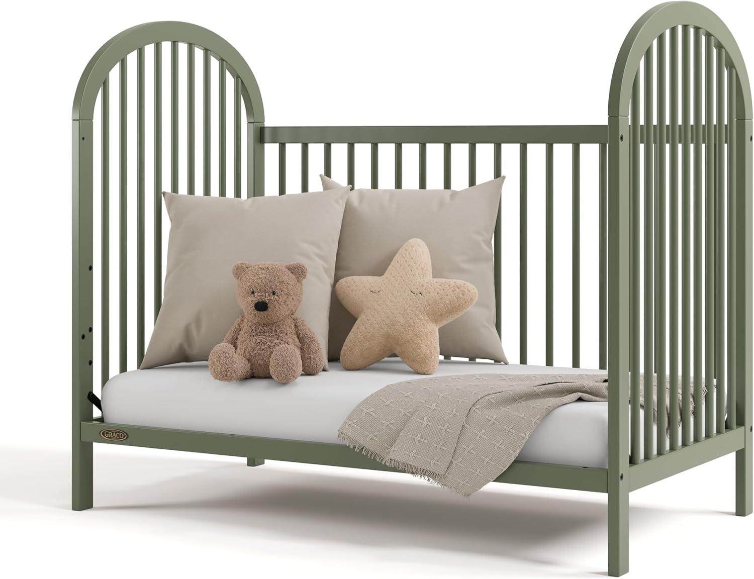 imageGraco Olivia Convertible Crib White GREENGUARD Gold Certified 100 Solid Wood Fits Standard Crib Mattress Converts to Toddler Bed and Daybed 4 Adjustable Mattress HeightsOlive