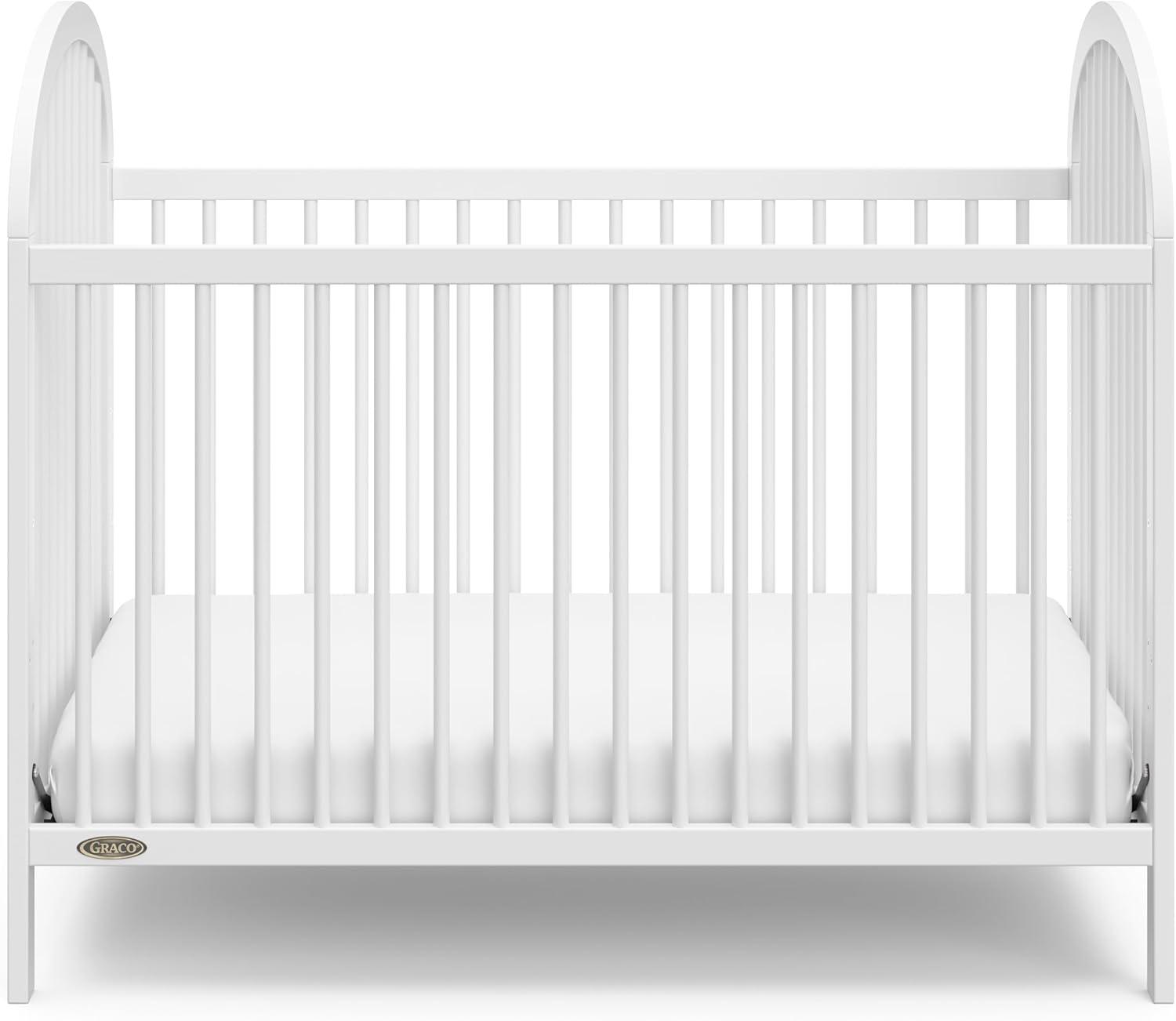 imageGraco Olivia Convertible Crib White GREENGUARD Gold Certified 100 Solid Wood Fits Standard Crib Mattress Converts to Toddler Bed and Daybed 4 Adjustable Mattress HeightsWhite
