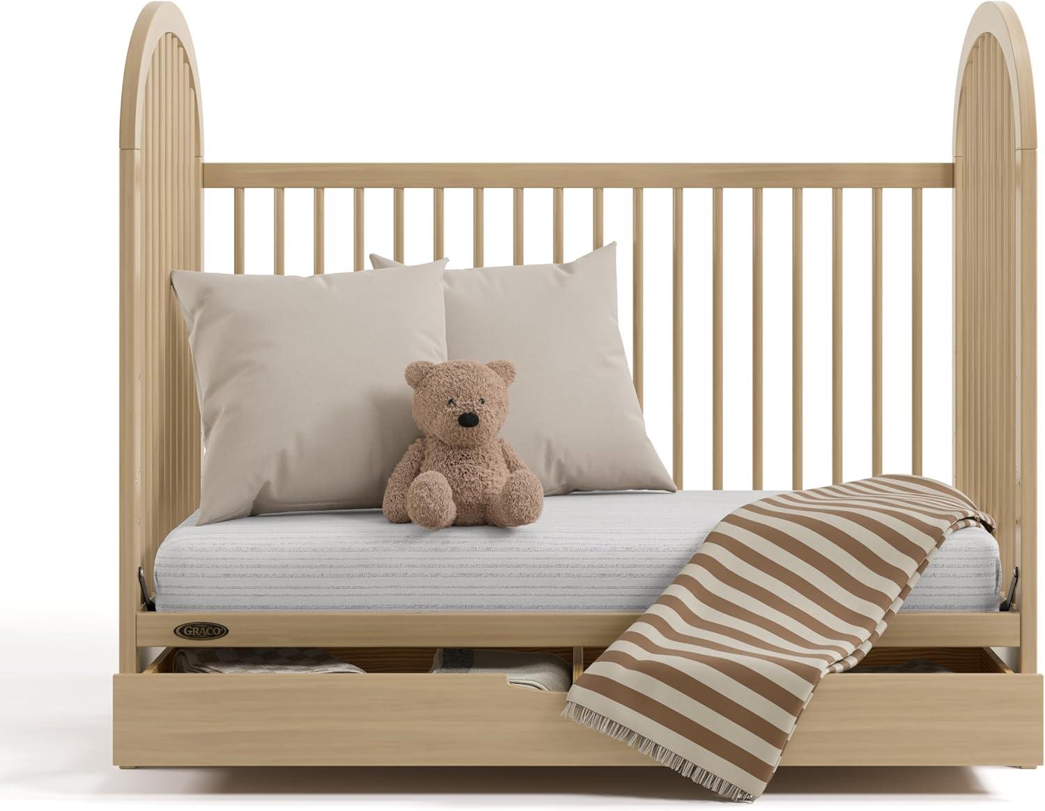 imageGraco Olivia Convertible Crib White GREENGUARD Gold Certified 100 Solid Wood Fits Standard Crib Mattress Converts to Toddler Bed and Daybed 4 Adjustable Mattress HeightsDriftwood