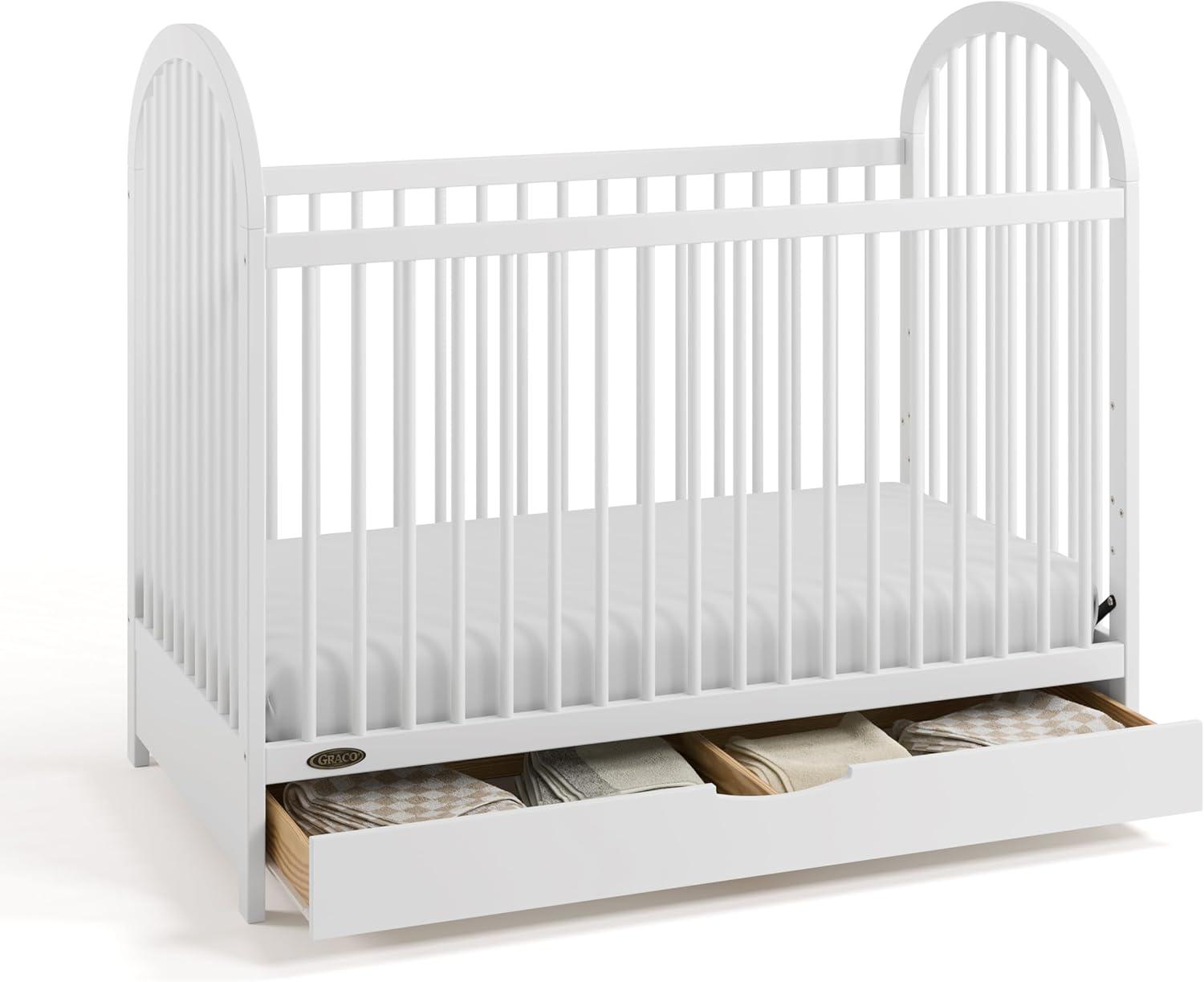 imageGraco Olivia Convertible Crib White GREENGUARD Gold Certified 100 Solid Wood Fits Standard Crib Mattress Converts to Toddler Bed and Daybed 4 Adjustable Mattress HeightsWhite