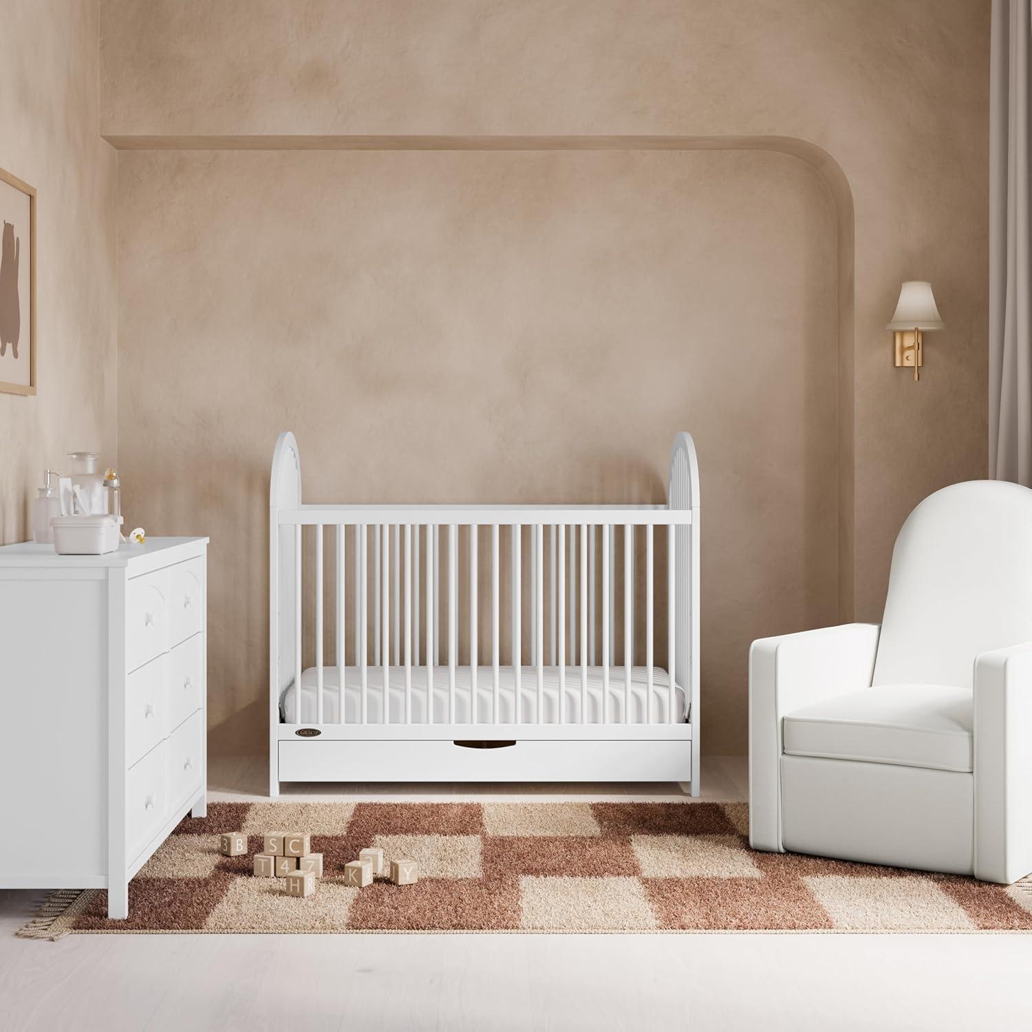 imageGraco Olivia Convertible Crib White GREENGUARD Gold Certified 100 Solid Wood Fits Standard Crib Mattress Converts to Toddler Bed and Daybed 4 Adjustable Mattress HeightsWhite