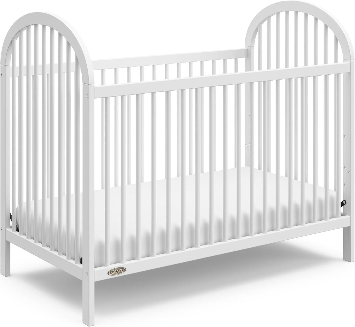 imageGraco Olivia Convertible Crib White GREENGUARD Gold Certified 100 Solid Wood Fits Standard Crib Mattress Converts to Toddler Bed and Daybed 4 Adjustable Mattress HeightsWhite