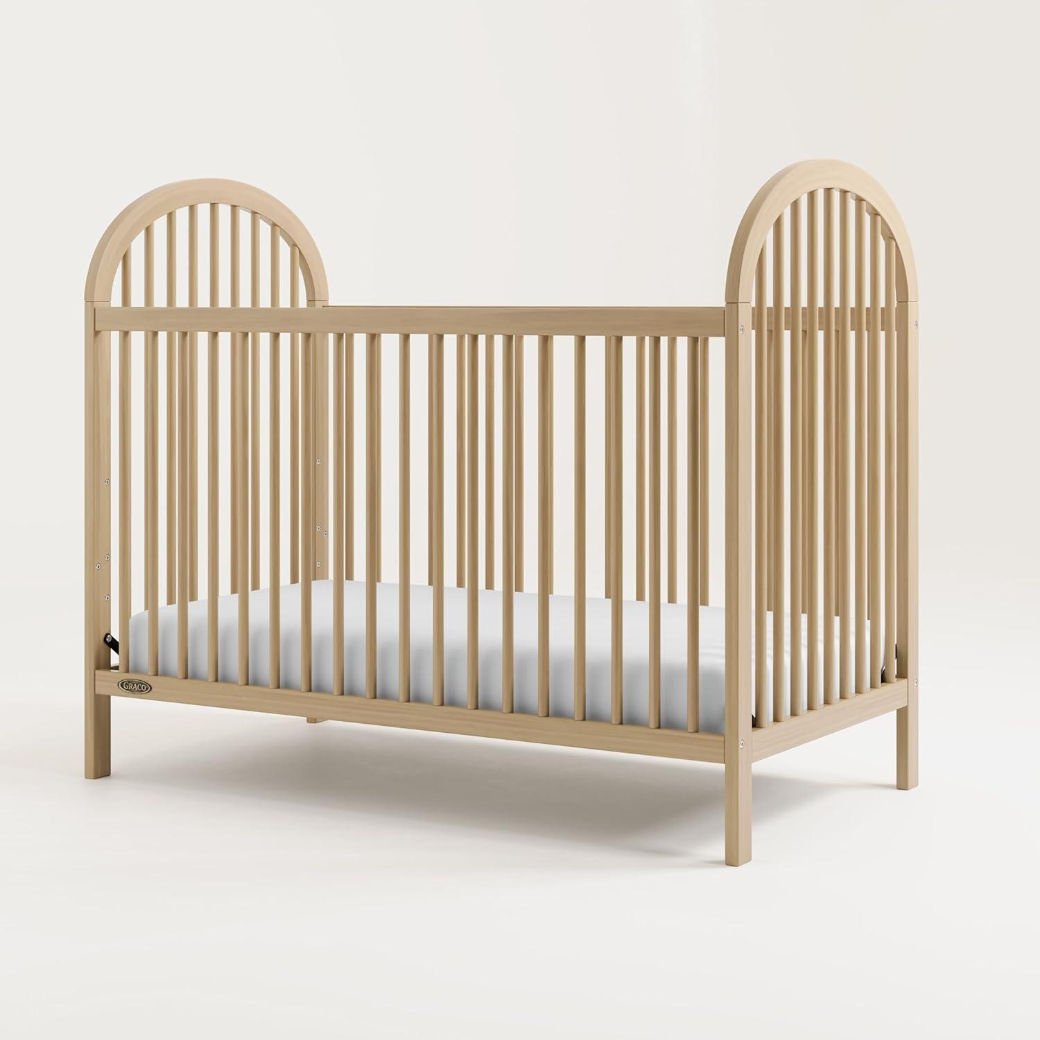 imageGraco Olivia Convertible Crib White GREENGUARD Gold Certified 100 Solid Wood Fits Standard Crib Mattress Converts to Toddler Bed and Daybed 4 Adjustable Mattress HeightsDriftwood
