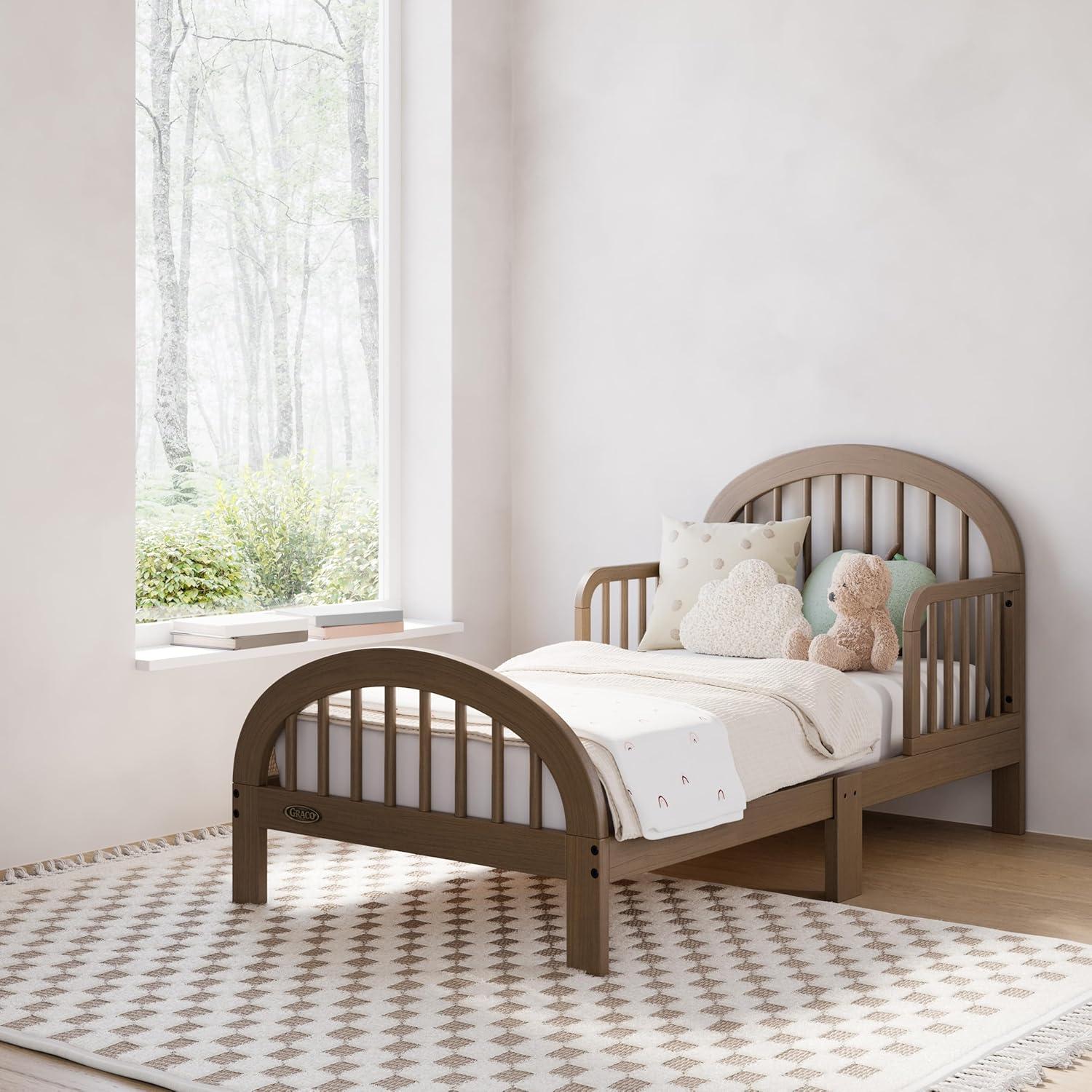imageGraco Olivia Toddler Bed Driftwood GREENGUARD Gold Certified Includes Toddler Safety Guardrails Fits Standard Crib ampamp Toddler Mattress Stylish Arched DesignHazelnut