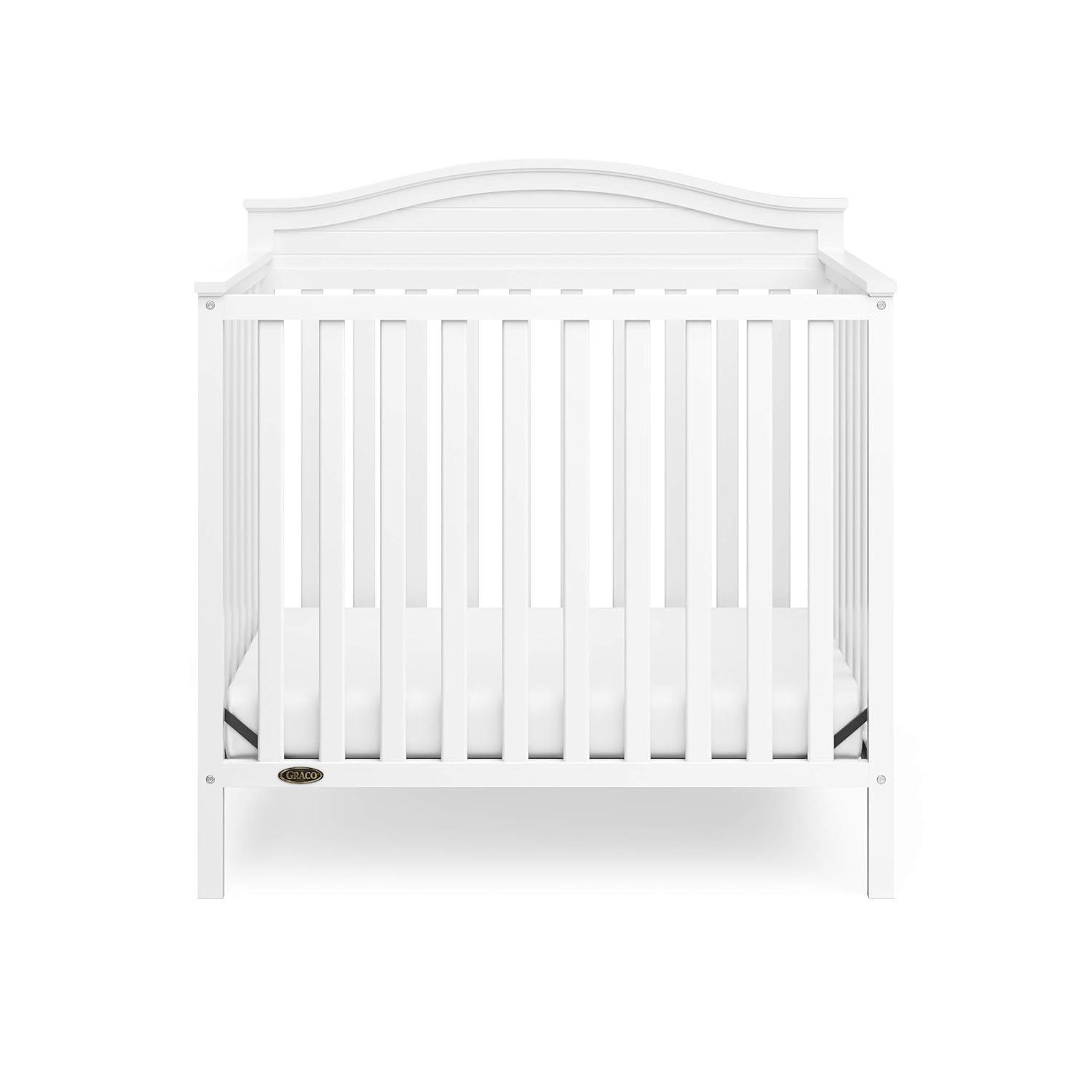 imageGraco Stella 4in1 Convertible Mini Crib with Bonus Mattress White Includes Bonus 275 Inch Thick Mattress with WaterResistant Cover Converts to Twin Bed Ideal Crib for Small SpacesWhite