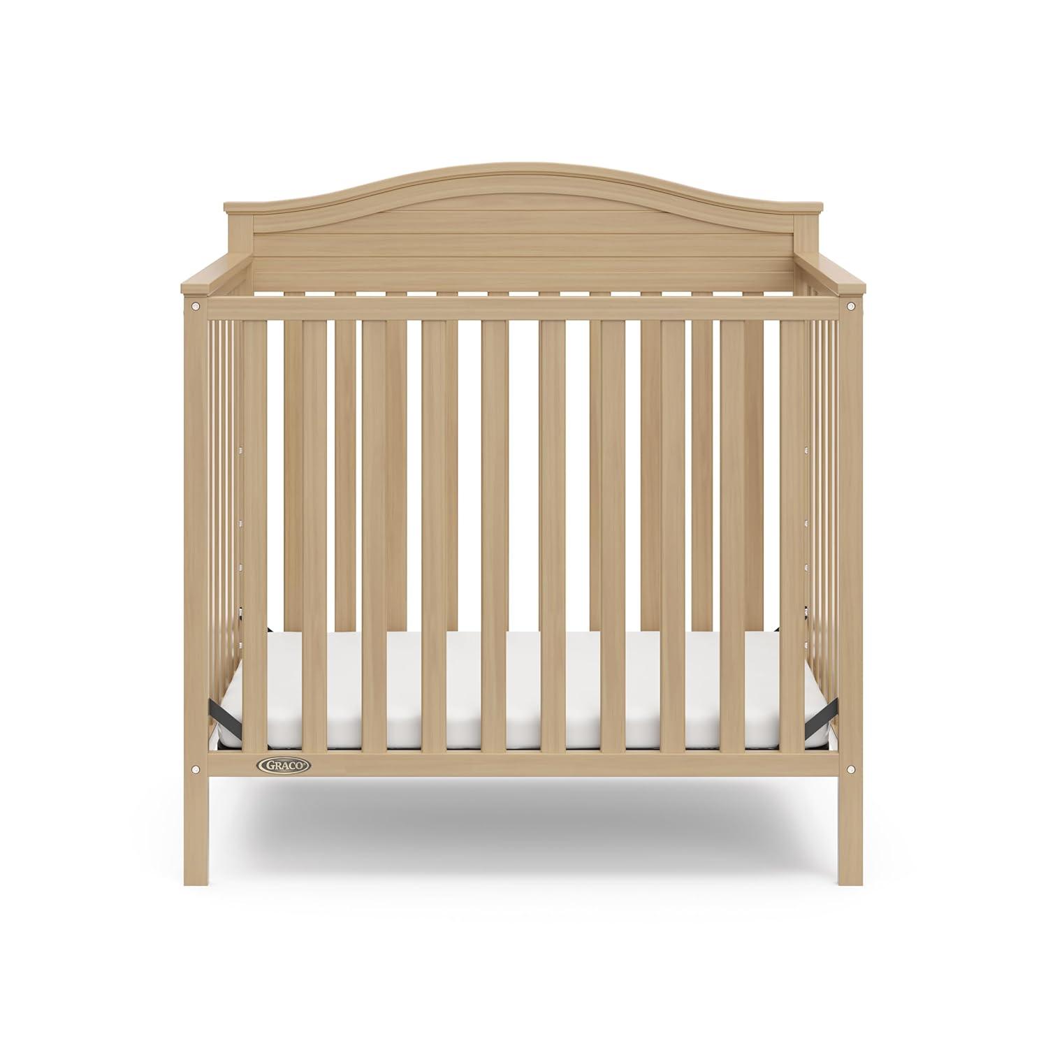 imageGraco Stella 4in1 Convertible Mini Crib with Bonus Mattress White Includes Bonus 275 Inch Thick Mattress with WaterResistant Cover Converts to Twin Bed Ideal Crib for Small SpacesDriftwood