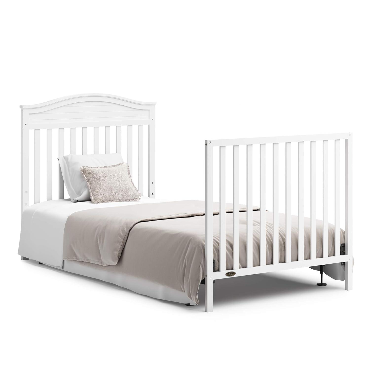 imageGraco Stella 4in1 Convertible Mini Crib with Bonus Mattress White Includes Bonus 275 Inch Thick Mattress with WaterResistant Cover Converts to Twin Bed Ideal Crib for Small SpacesWhite