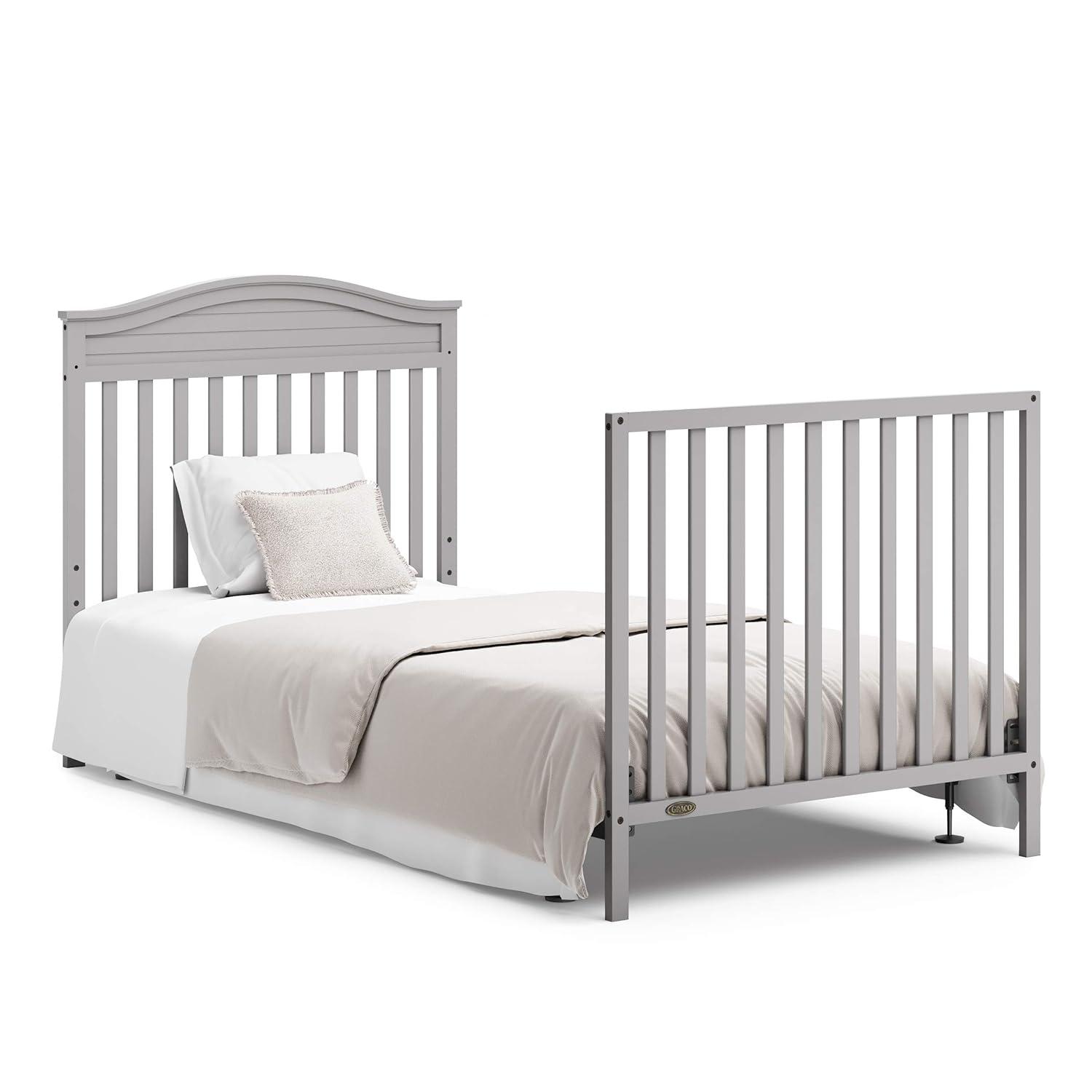imageGraco Stella 4in1 Convertible Mini Crib with Bonus Mattress White Includes Bonus 275 Inch Thick Mattress with WaterResistant Cover Converts to Twin Bed Ideal Crib for Small SpacesPebble Gray