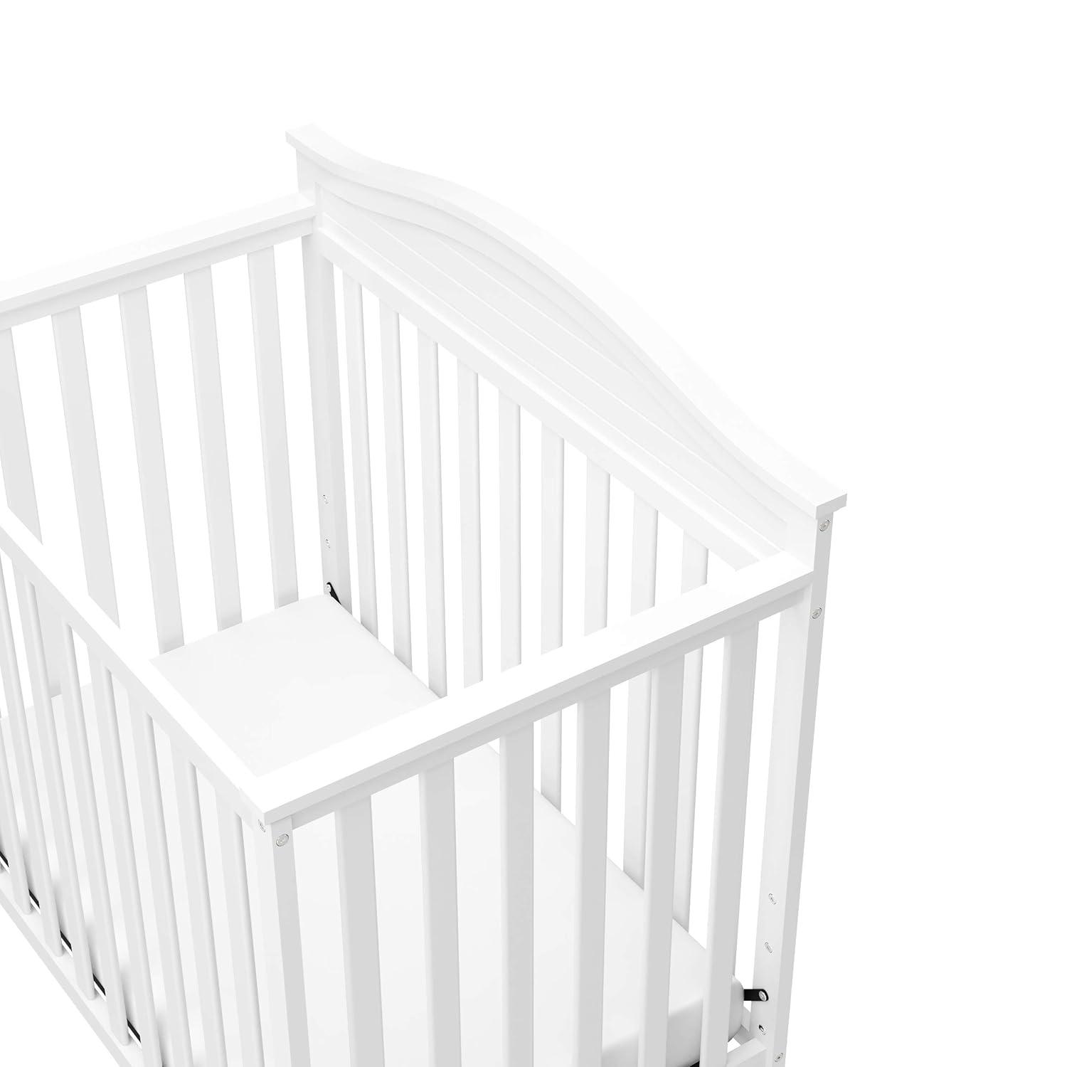 imageGraco Stella 4in1 Convertible Mini Crib with Bonus Mattress White Includes Bonus 275 Inch Thick Mattress with WaterResistant Cover Converts to Twin Bed Ideal Crib for Small SpacesWhite