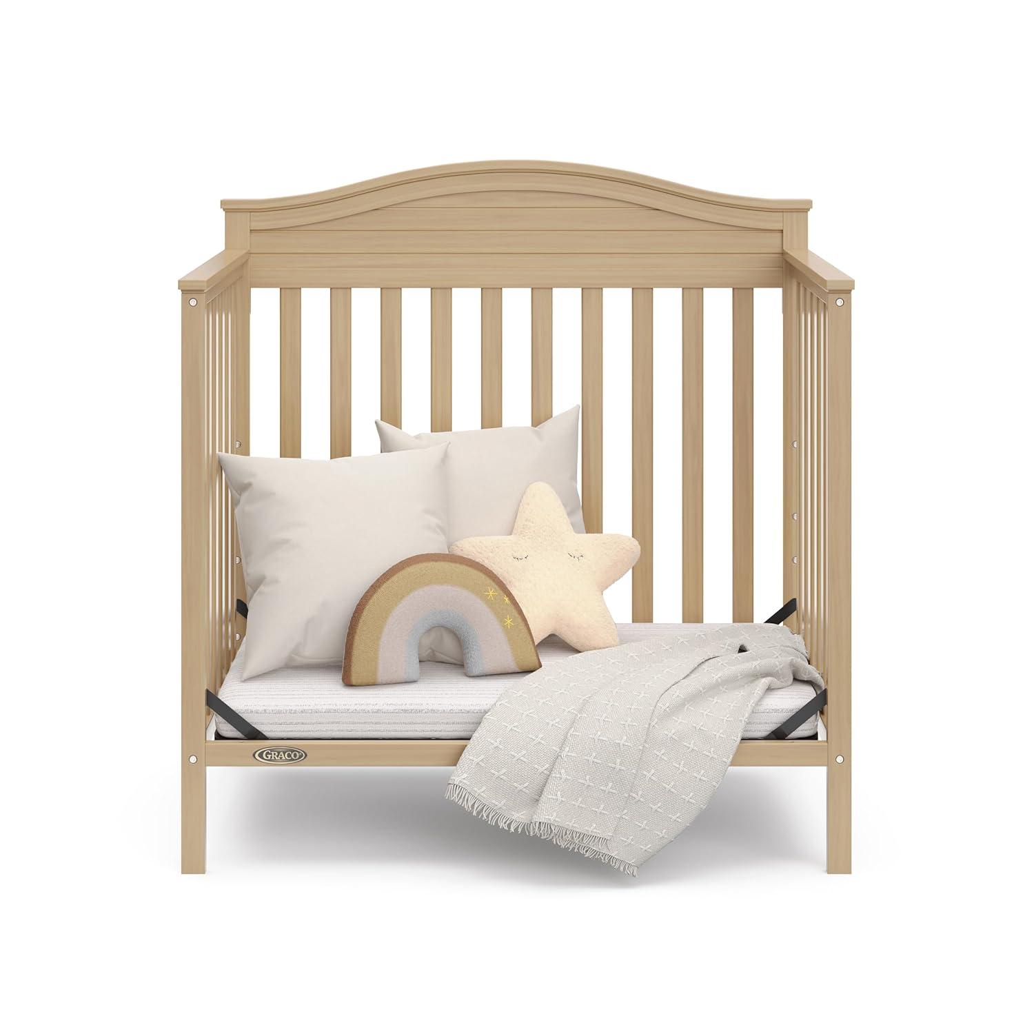 imageGraco Stella 4in1 Convertible Mini Crib with Bonus Mattress White Includes Bonus 275 Inch Thick Mattress with WaterResistant Cover Converts to Twin Bed Ideal Crib for Small SpacesDriftwood