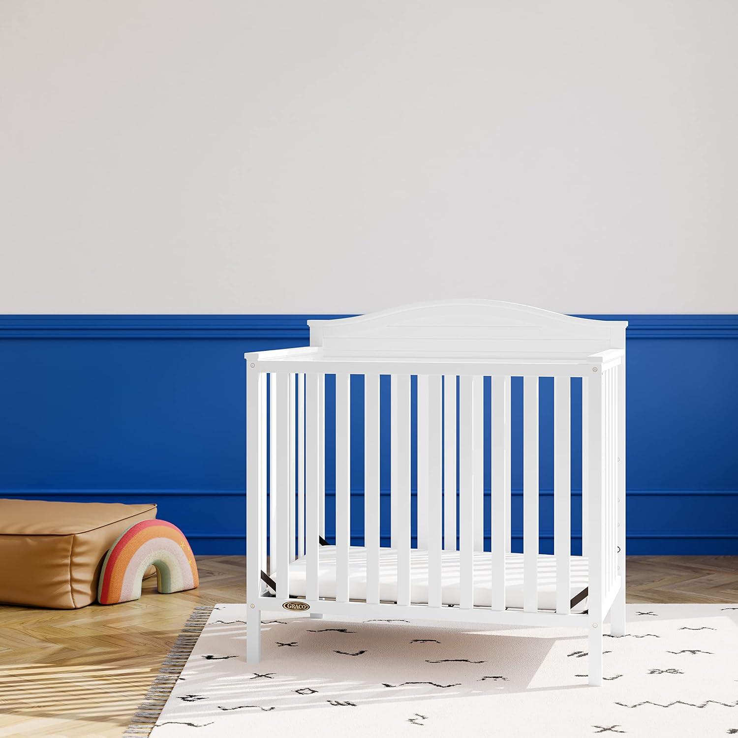 imageGraco Stella 4in1 Convertible Mini Crib with Bonus Mattress White Includes Bonus 275 Inch Thick Mattress with WaterResistant Cover Converts to Twin Bed Ideal Crib for Small SpacesWhite