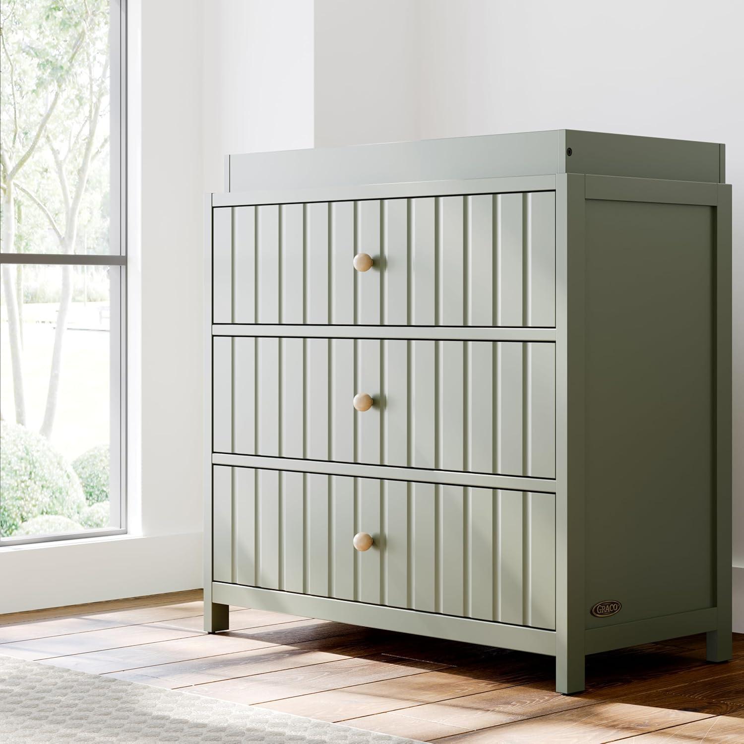 imageGraco Teddi 6 Drawer Double Dresser Olive GREENGUARD Gold Certified Interlocking Drawer System PreInstalled Drawer Tracks Includes Two Sets of Knobs for PersonalizationOlive