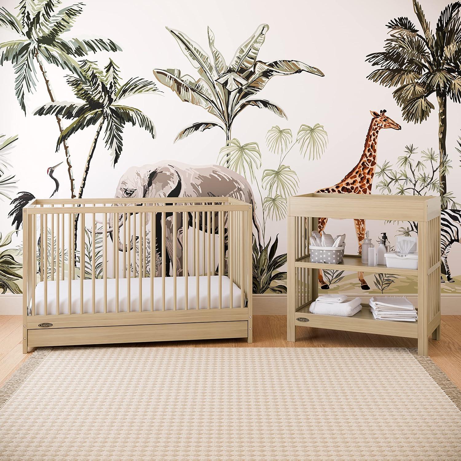 imageGraco Teddi Changing Table with WaterResistant Changing Pad Driftwood GREENGUARD Gold Certified Includes Bonus WaterResistant Changing Pad with Safety Strap 2 Shelves EasytoMatchDriftwood