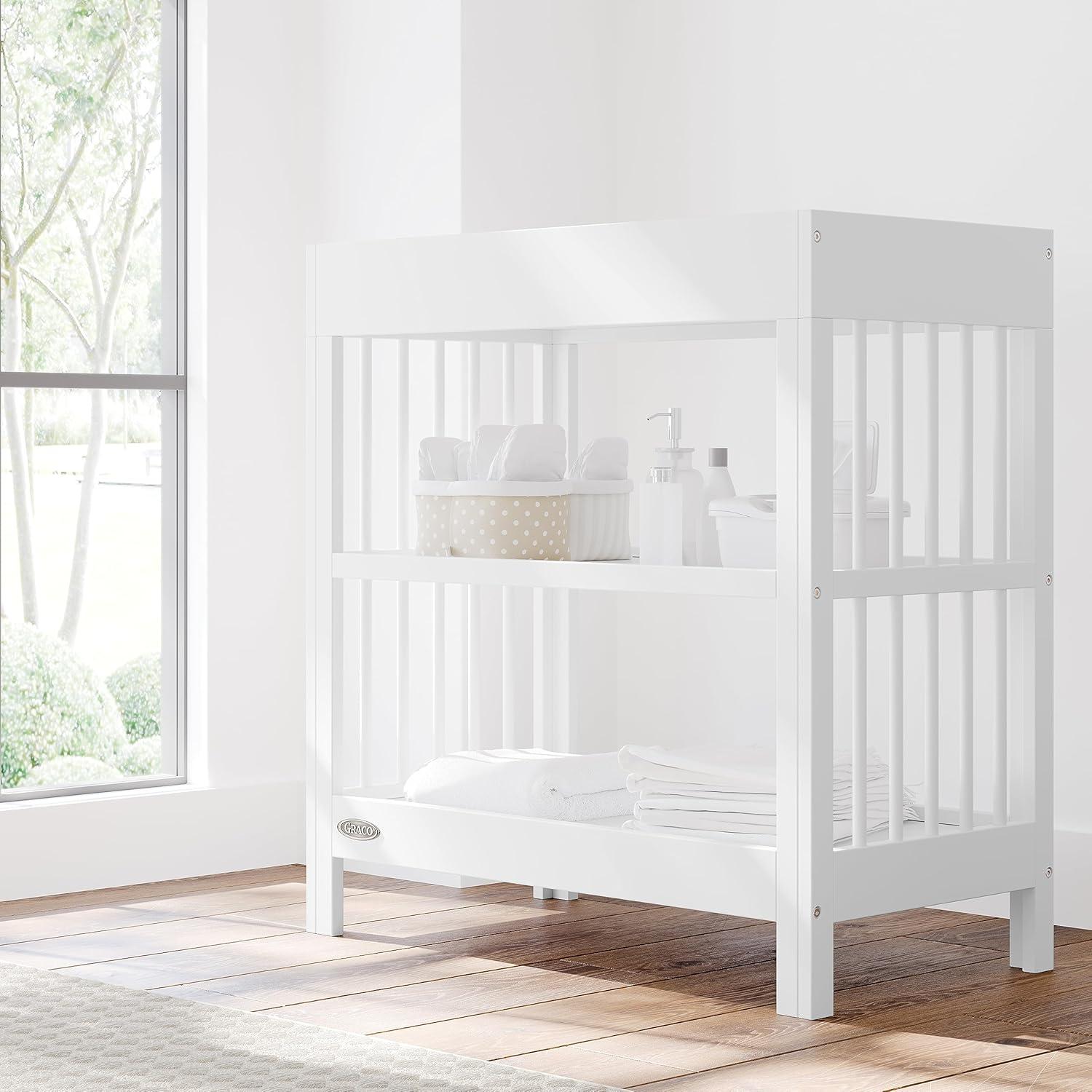 imageGraco Teddi Changing Table with WaterResistant Changing Pad Driftwood GREENGUARD Gold Certified Includes Bonus WaterResistant Changing Pad with Safety Strap 2 Shelves EasytoMatchWhite