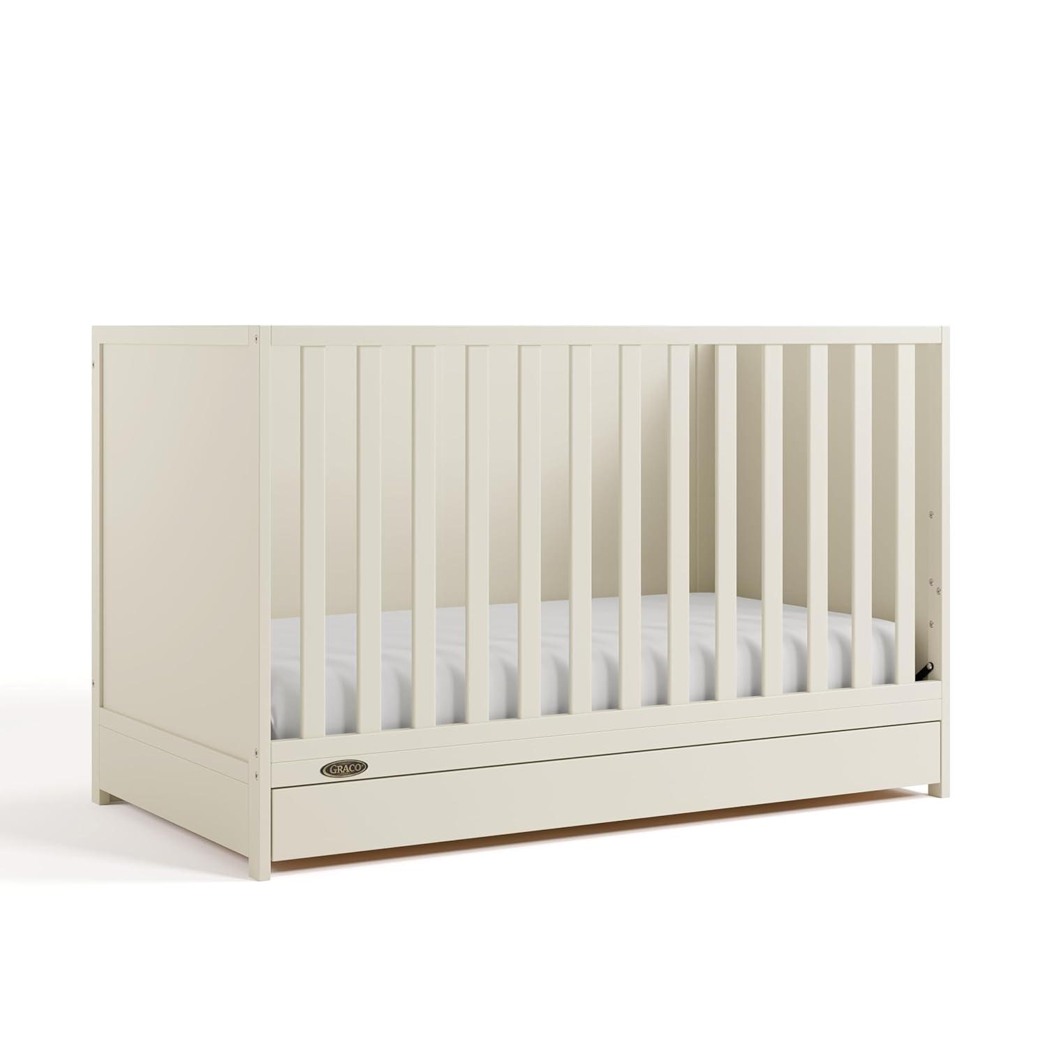 imageGraco Theo 3in1 Convertible Baby Crib White GREENGUARD Gold Certified Converts to Toddler Bed ampamp Daybed Fits Standard FullSize Baby Crib Mattress 4 Adjustable Mattress HeightsFrosted Oat