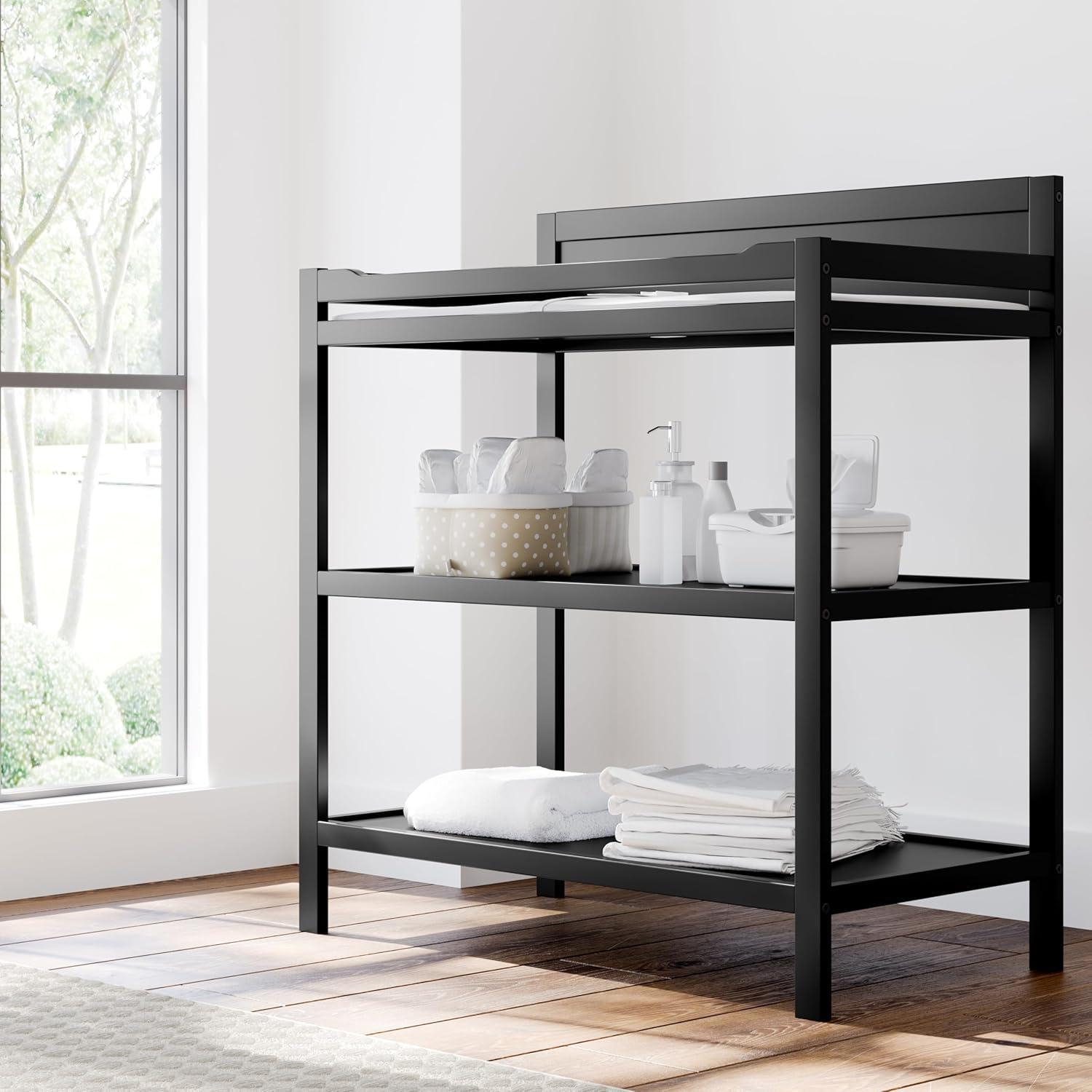 imageStorkcraft Alpine Changing Table White GREENGUARD Gold Certified Nursery Changing Table Includes WaterResistant Changing Pad 2 Shelves for Nursery Storage and OrganizingBlack