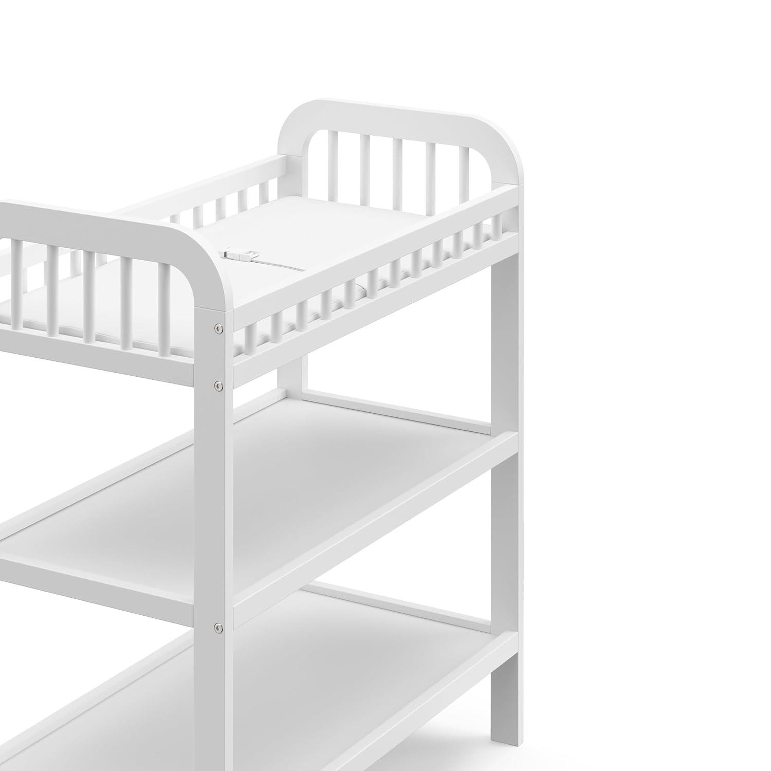 imageStorkcraft Pasadena Changing Table with WaterResistant Changing Pad Driftwood GREENGUARD Gold Certified Includes Bonus WaterResistant Changing Pad with Safety Strap 2 Open ShelvesWhite