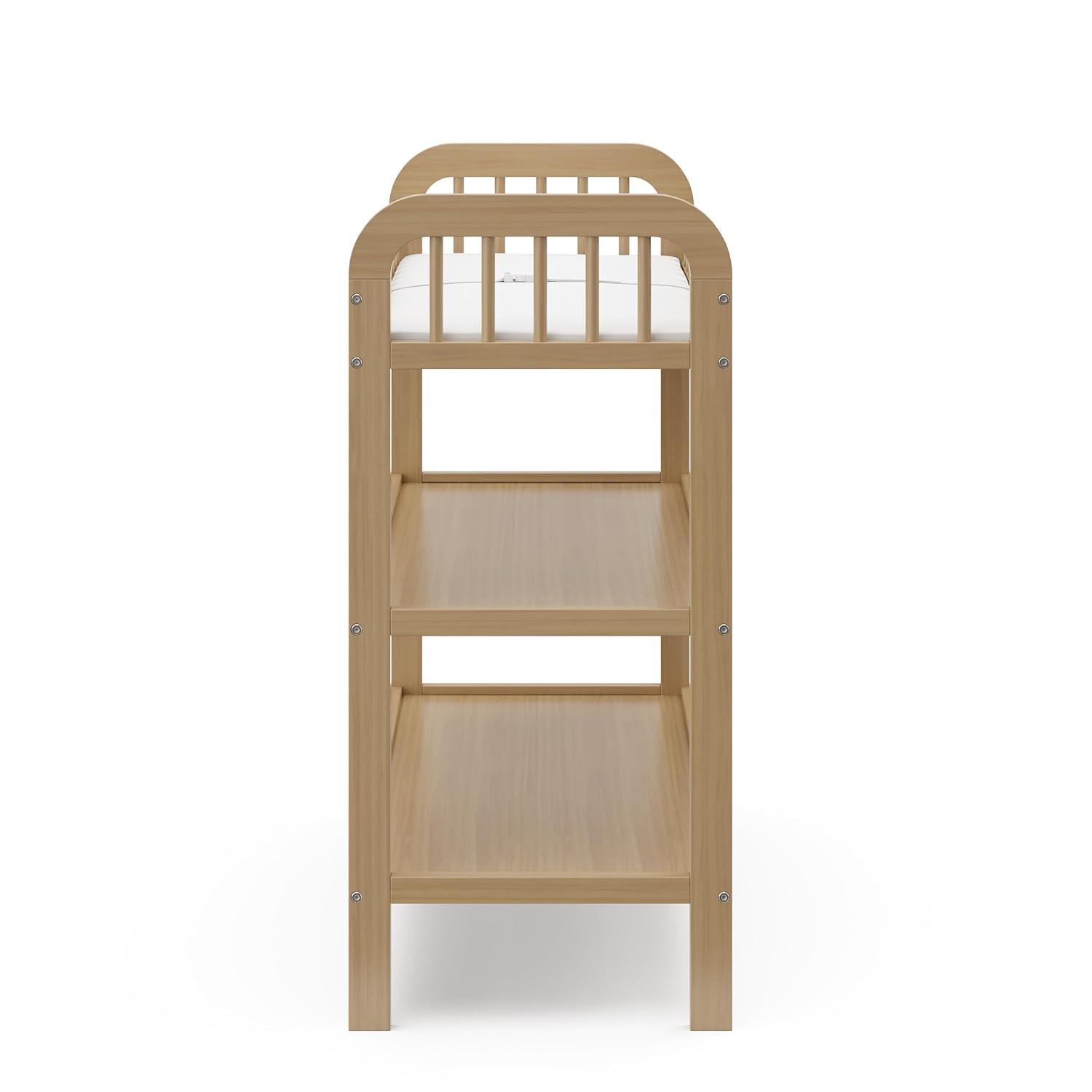 imageStorkcraft Pasadena Changing Table with WaterResistant Changing Pad Driftwood GREENGUARD Gold Certified Includes Bonus WaterResistant Changing Pad with Safety Strap 2 Open ShelvesDriftwood