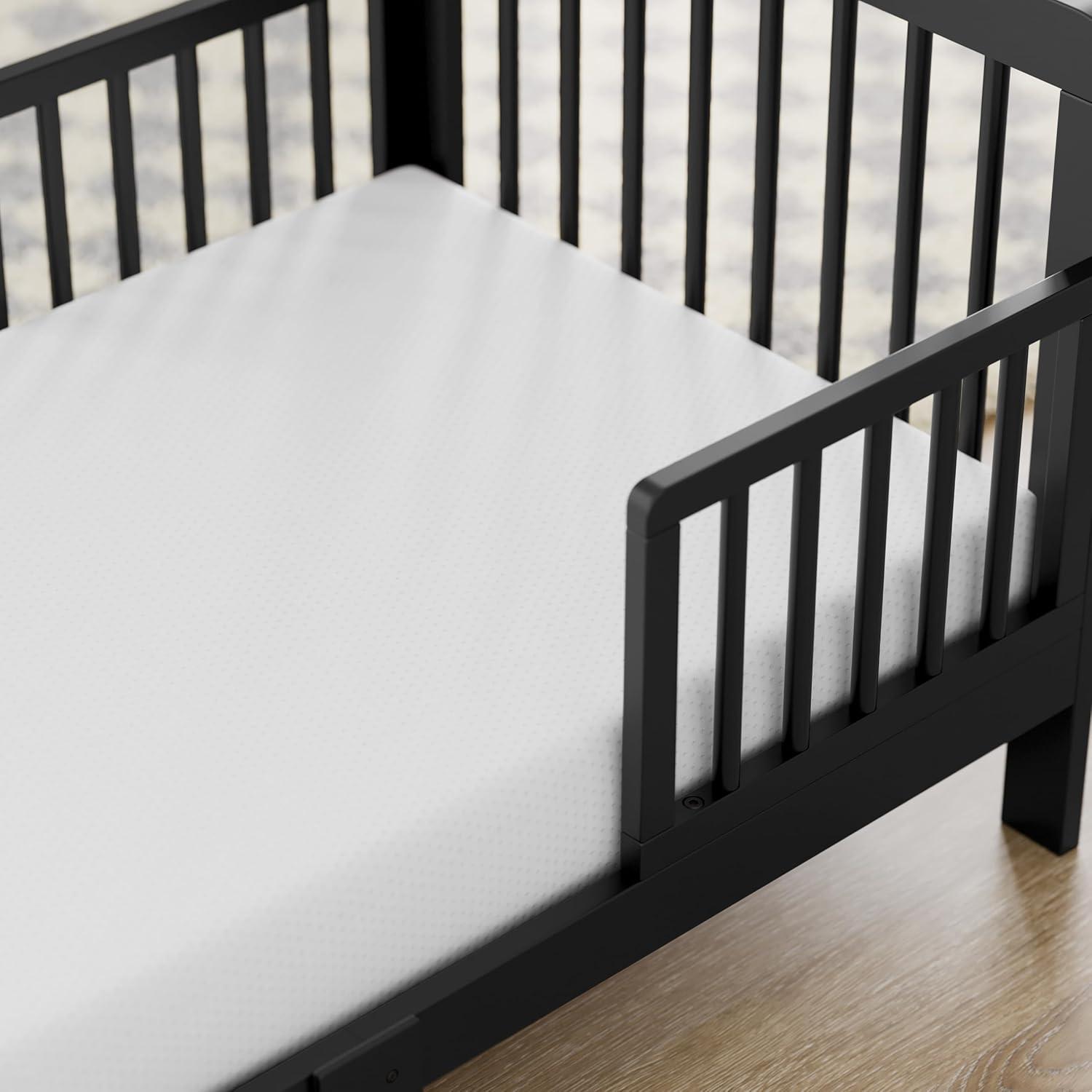 imageStorkcraft Pasadena Toddler Bed White with Driftwood GREENGUARD Gold Certified Fits Standard FullSize Crib ampamp Toddler Mattress Toddler Safety Guardrails Included Complete Design with FootboardBlack