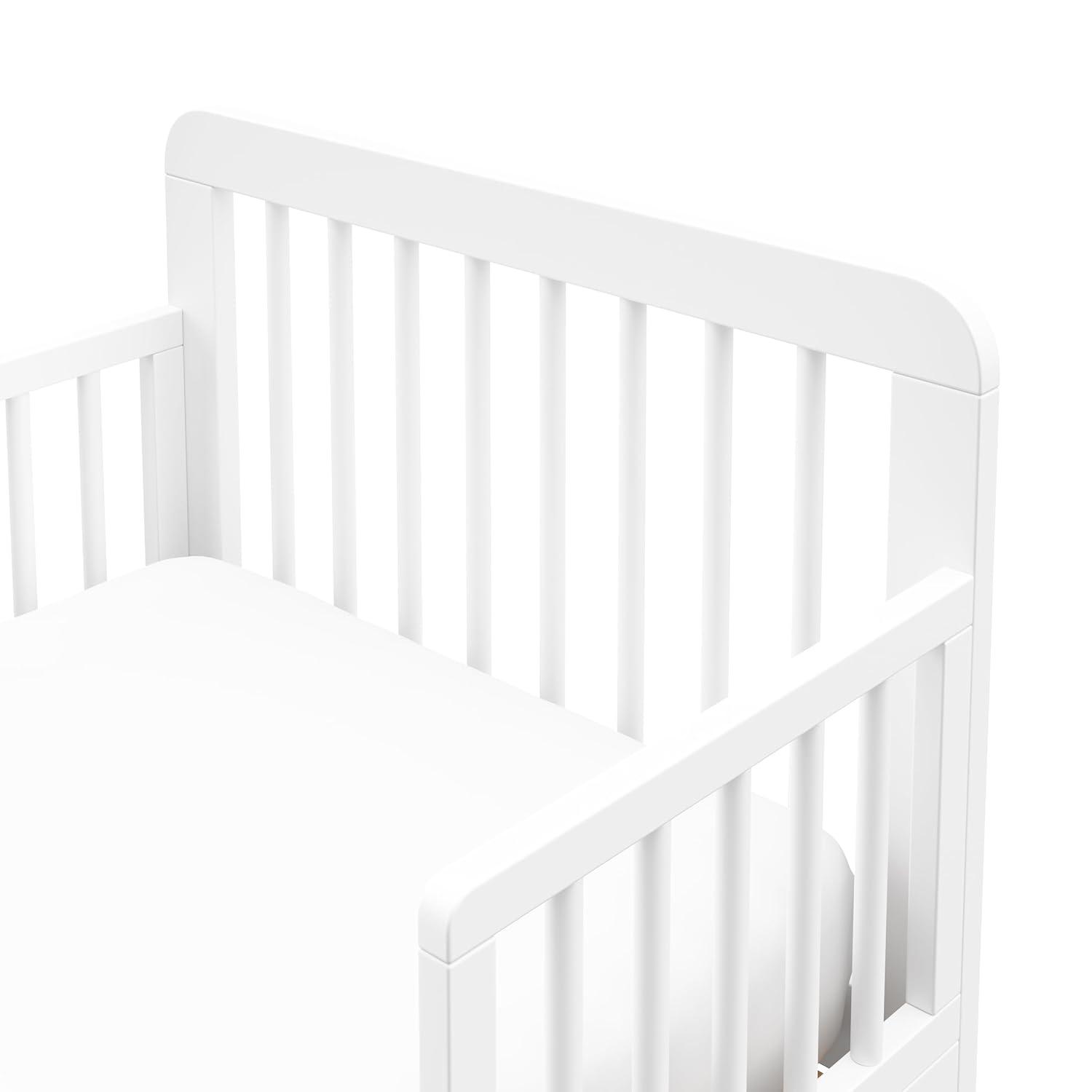 imageStorkcraft Pasadena Toddler Bed White with Driftwood GREENGUARD Gold Certified Fits Standard FullSize Crib ampamp Toddler Mattress Toddler Safety Guardrails Included Complete Design with FootboardWhite