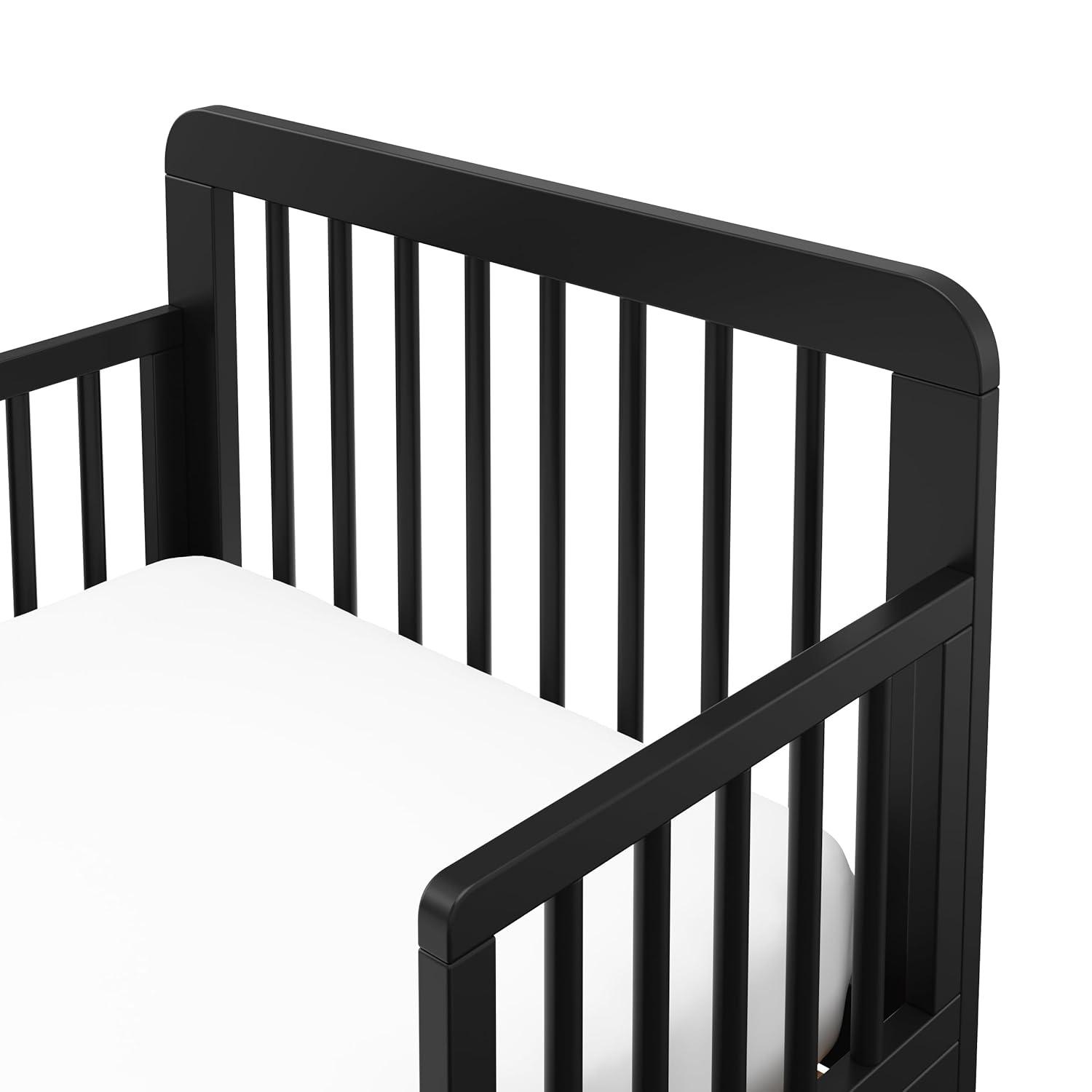 imageStorkcraft Pasadena Toddler Bed White with Driftwood GREENGUARD Gold Certified Fits Standard FullSize Crib ampamp Toddler Mattress Toddler Safety Guardrails Included Complete Design with FootboardBlack