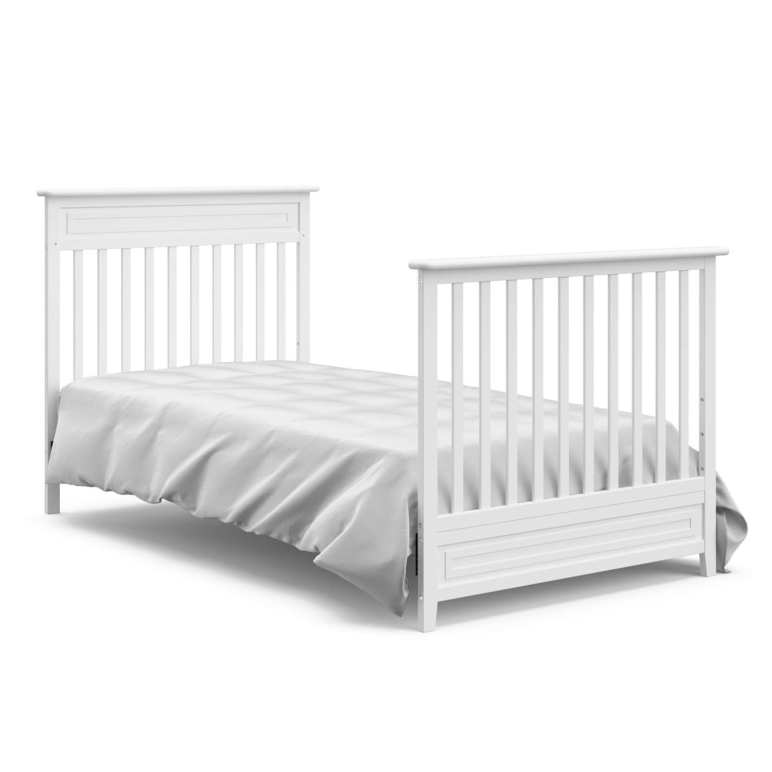 imageStorkcraft Petal 4in1 Convertible Mini Crib White GREENGUARD Gold Certified Converts to Daybed and TwinSize Bed Bonus 275inch Mini Crib Mattress Included Ideal for Small SpacesWhite