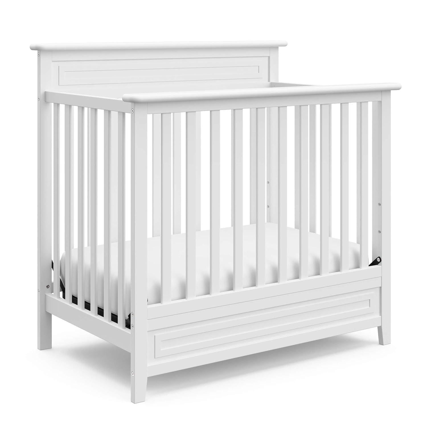 imageStorkcraft Petal 4in1 Convertible Mini Crib White GREENGUARD Gold Certified Converts to Daybed and TwinSize Bed Bonus 275inch Mini Crib Mattress Included Ideal for Small SpacesWhite