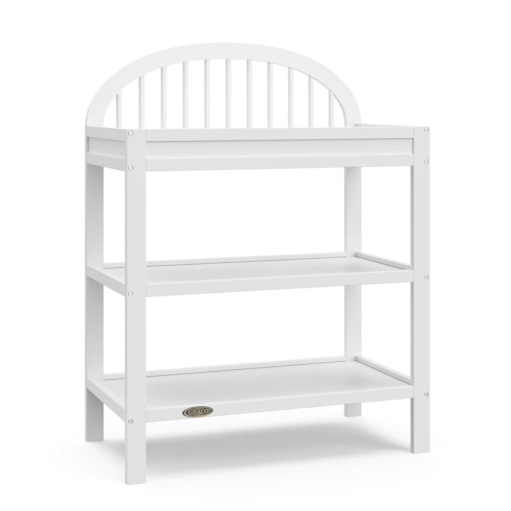 imageGraco Olivia Changing Table with WaterResistant Changing Pad Driftwood GREENGUARD Gold Certified Includes Bonus WaterResistant Changing Pad with Safety Strap 2 Open Shelves Stylish DesignWhite