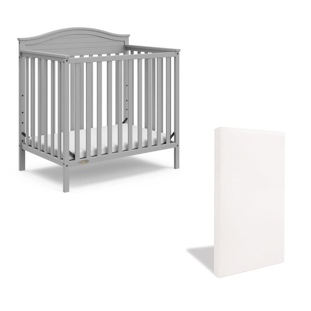 imageGraco Stella 4in1 Convertible Mini Crib with Bonus Mattress White Includes Bonus 275 Inch Thick Mattress with WaterResistant Cover Converts to Twin Bed Ideal Crib for Small SpacesPebble Gray